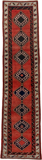 2' x 9' one-of-a-kind handmade antique Sarab runner rug. Color palette: terra cotta, ivory, navy, rust, charcoal, camel