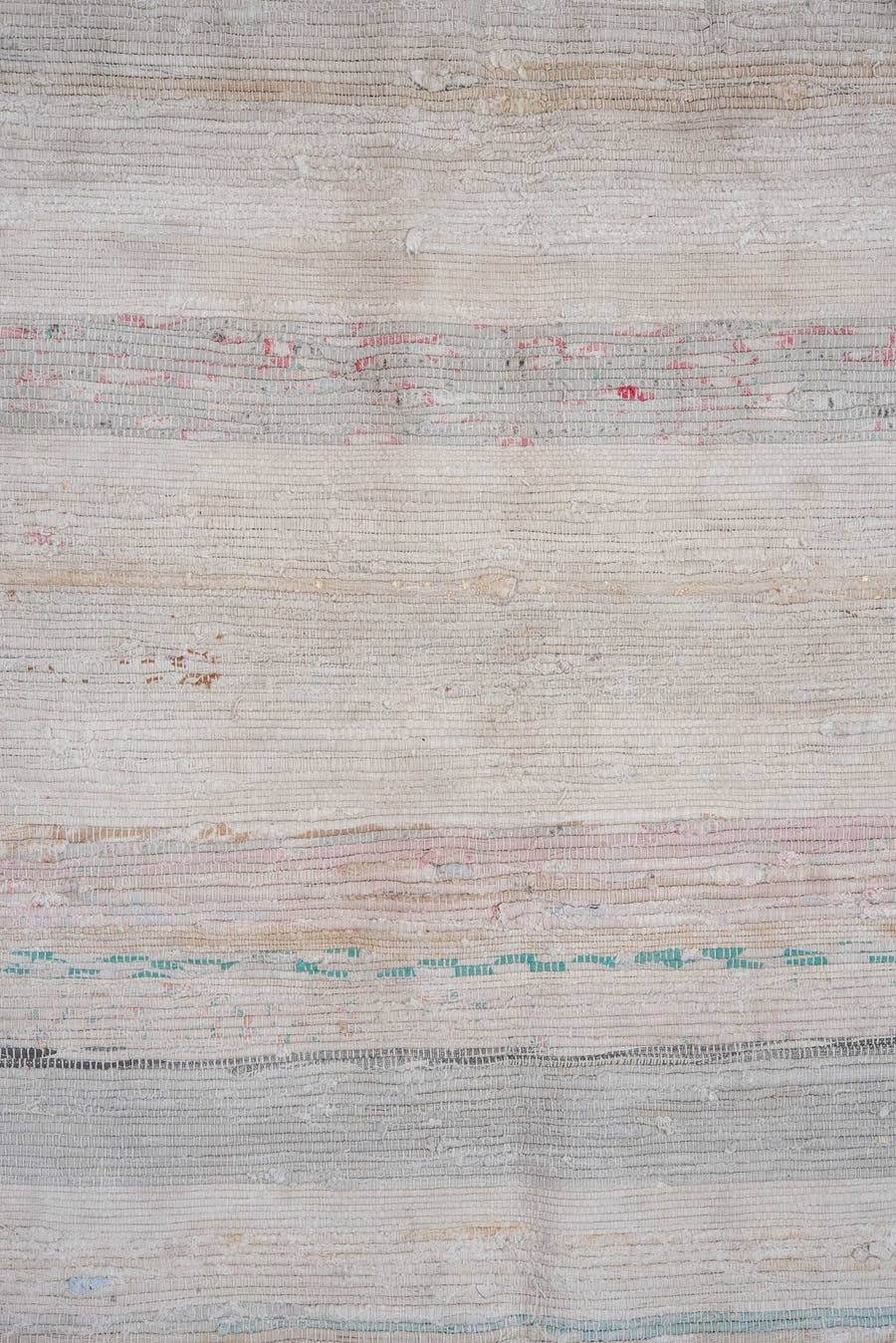 5' x 11' one-of-a-kind handmade antique Rag Rug rug. Color palette: ivory, pale blue, blush, taupe, charcoal, aqua