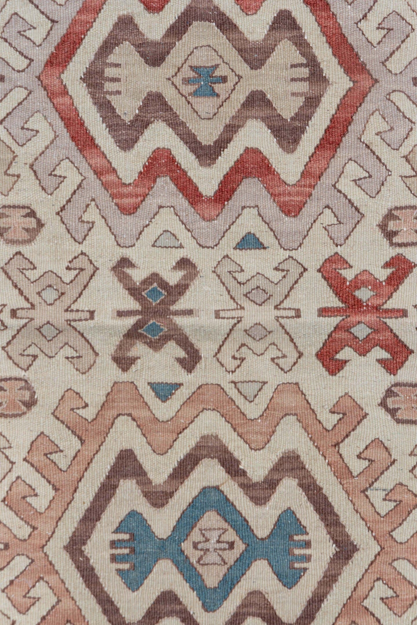 2' x 4' one-of-a-kind handmade antique Kilim small size rug. Color palette: ivory, brown, rust, blue, taupe, rose
