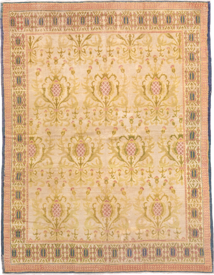 5' x 7' one-of-a-kind handmade antique Spanish rug. Color palette: ivory, olive, rose, gold, navy, sage, green, pink, red