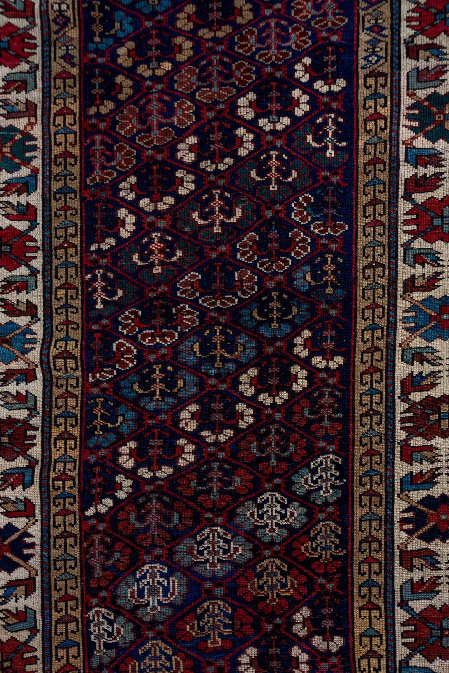 3' x 12' one-of-a-kind handmade antique NW Persian runner rug. Color palette: indigo, ivory, rust, sky blue, crimson, navy