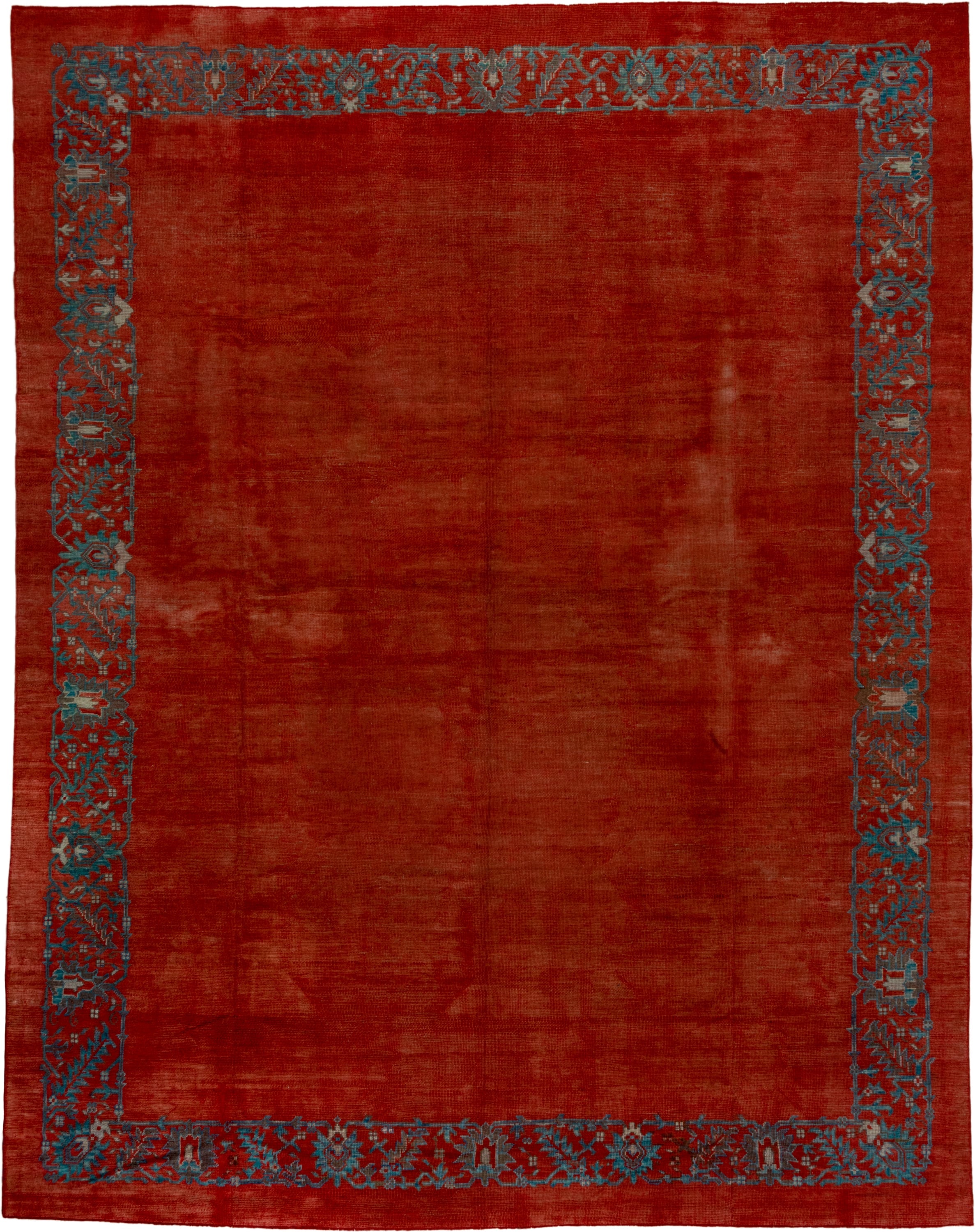 12' x 16' one-of-a-kind handmade antique Oushak oversize rug. Color palette: rust, terra cotta, slate, blue, brick, taupe