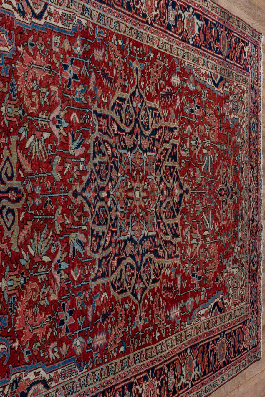 7' x 10' one-of-a-kind handmade antique Heriz large size rug. Color palette: red, navy, ivory, sky blue, rose, burgundy