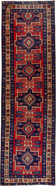 3' x 10' one-of-a-kind handmade antique Heriz runner rug. Color palette: red, navy, ivory, camel, rust, charcoal, blue