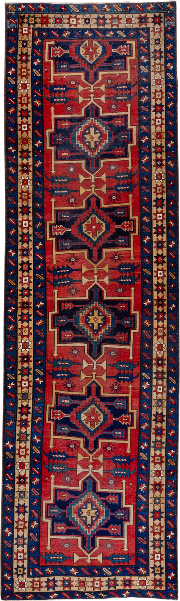 3' x 10' one-of-a-kind handmade antique Heriz runner rug. Color palette: red, navy, ivory, camel, rust, charcoal, blue