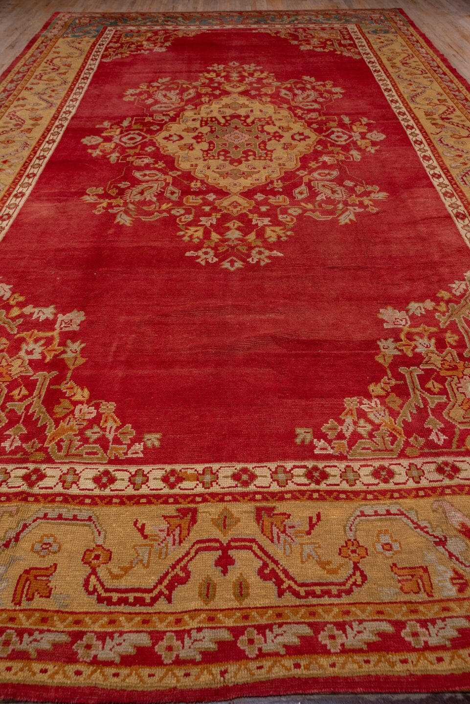 12' x 20' one-of-a-kind handmade antique Oushak oversize rug. Color palette: terra cotta, gold, rust, muted blue, ivory