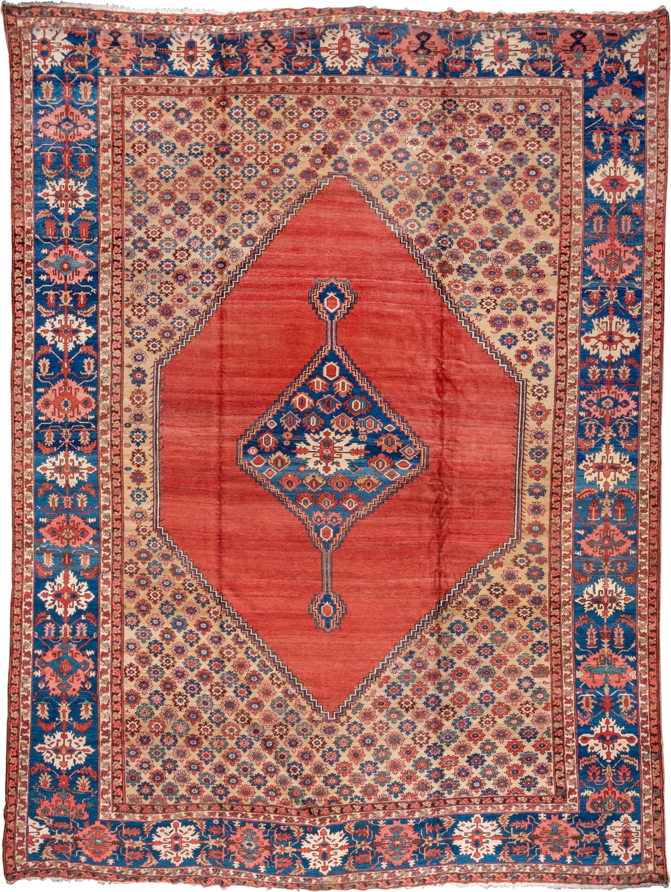 15' x 20' one-of-a-kind handmade antique Serapi oversize rug. Color palette: terra cotta, indigo, ivory, rust, coral, navy