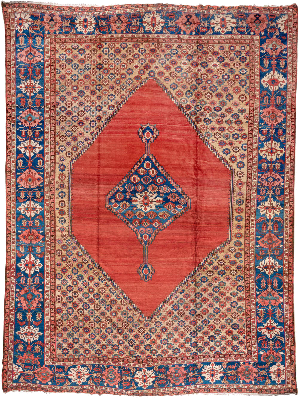 15' x 20' one-of-a-kind handmade antique Serapi oversize rug. Color palette: terra cotta, indigo, ivory, rust, coral, navy