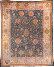 11' x 14' one-of-a-kind handmade antique Oushak oversize rug. Color palette: ivory, slate, gold, peach, taupe, saffron