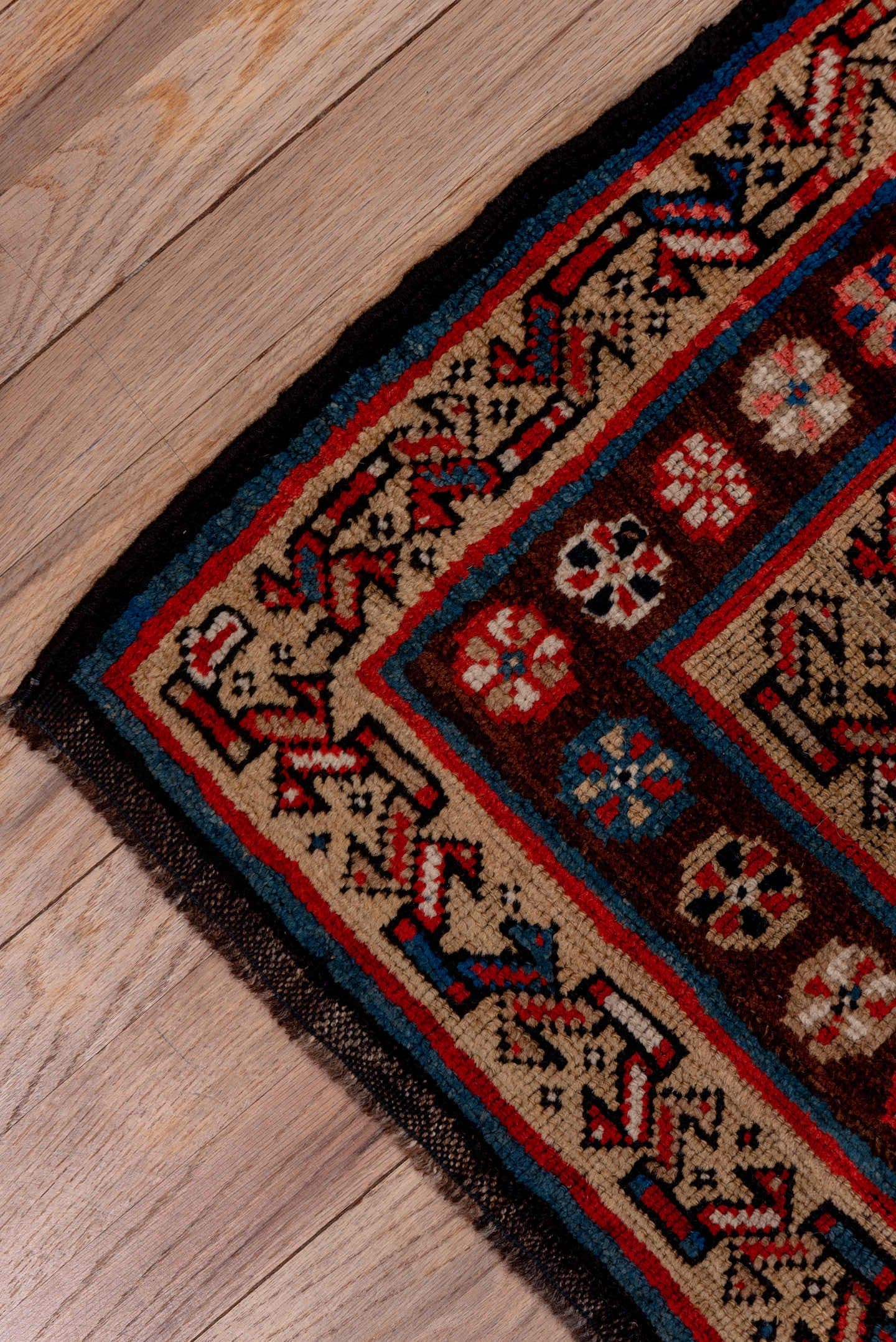3' x 11' one-of-a-kind handmade antique Kurd runner rug. Color palette: navy, ivory, rust, crimson, camel, slate, blue