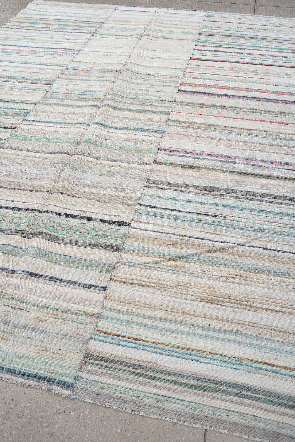 6' x 9' one-of-a-kind handmade antique Rag Rug medium size rug. Color palette: ivory, aqua, pale blue, charcoal, slate, rose