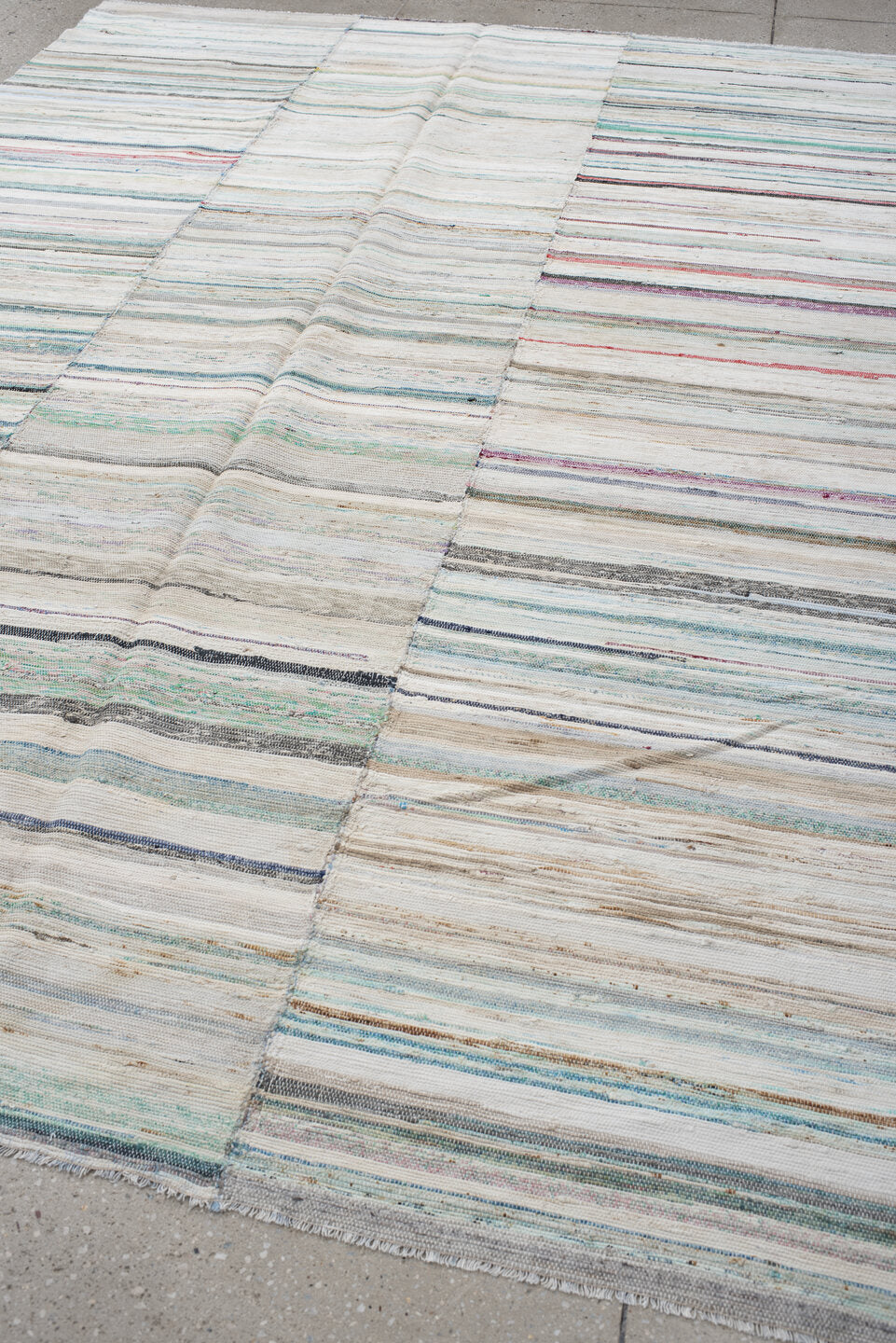 6' x 9' one-of-a-kind handmade antique Rag Rug medium size rug. Color palette: ivory, aqua, pale blue, charcoal, slate, rose
