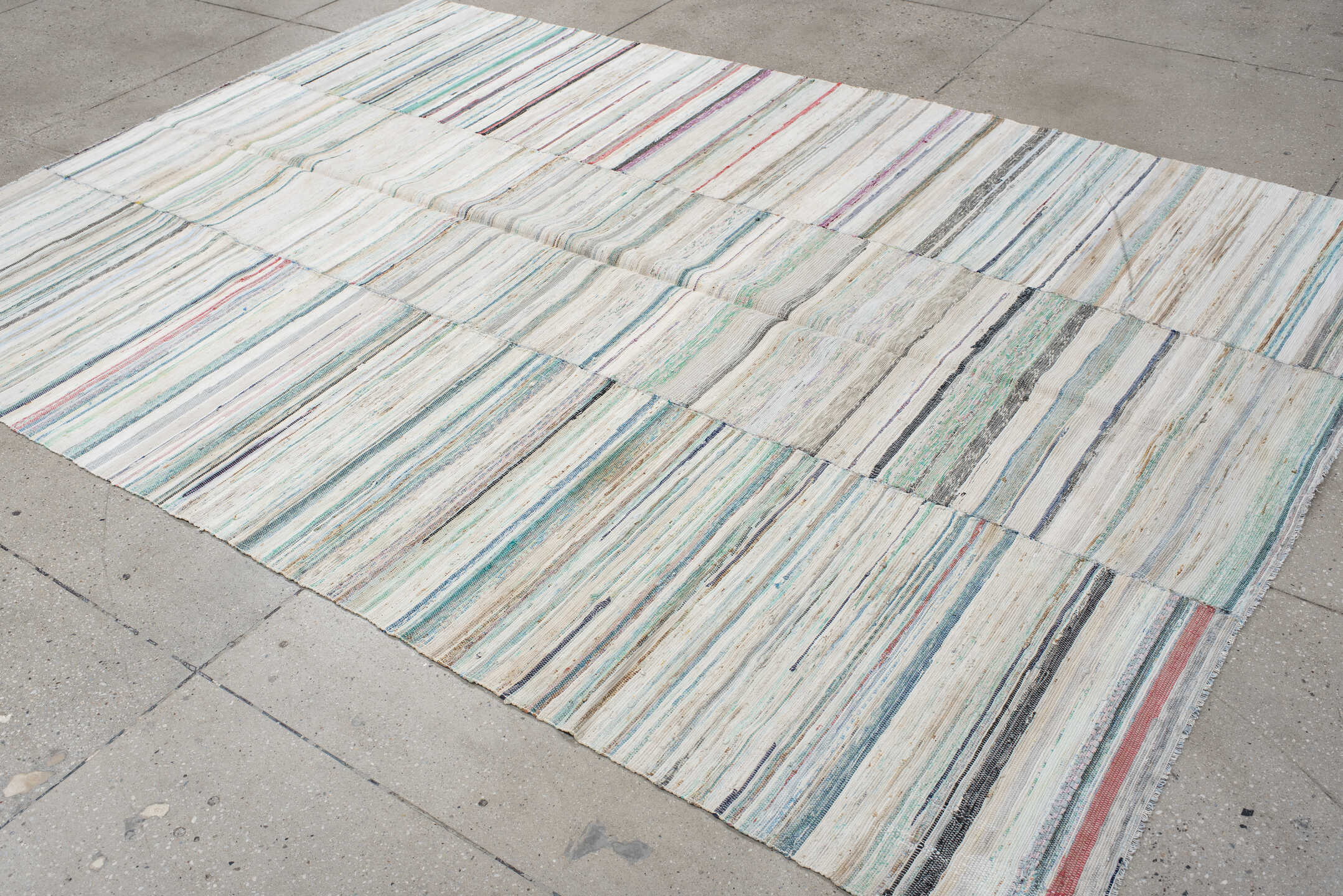 6' x 9' one-of-a-kind handmade antique Rag Rug medium size rug. Color palette: ivory, aqua, pale blue, charcoal, slate, rose