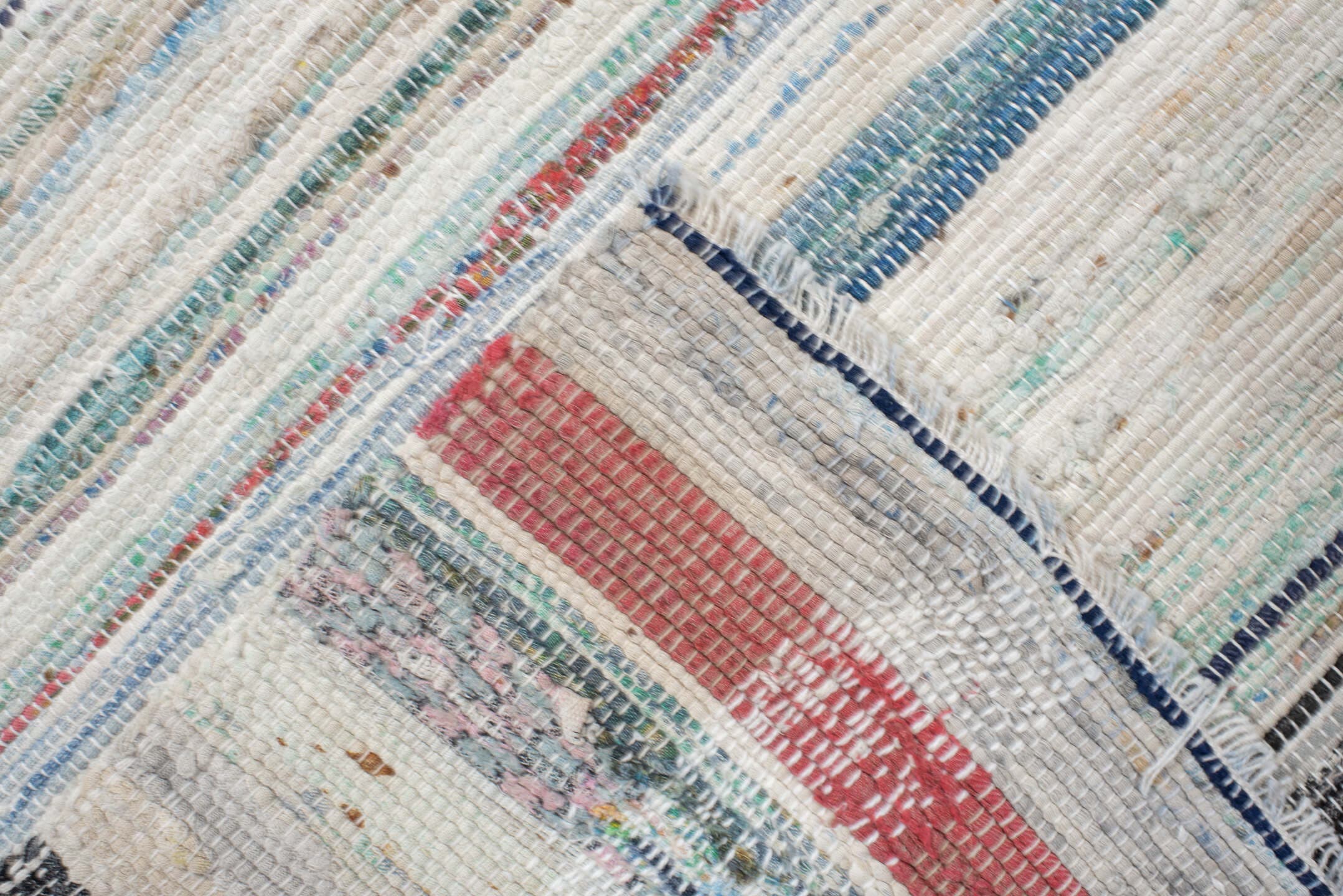 6' x 9' one-of-a-kind handmade antique Rag Rug medium size rug. Color palette: ivory, aqua, pale blue, charcoal, slate, rose