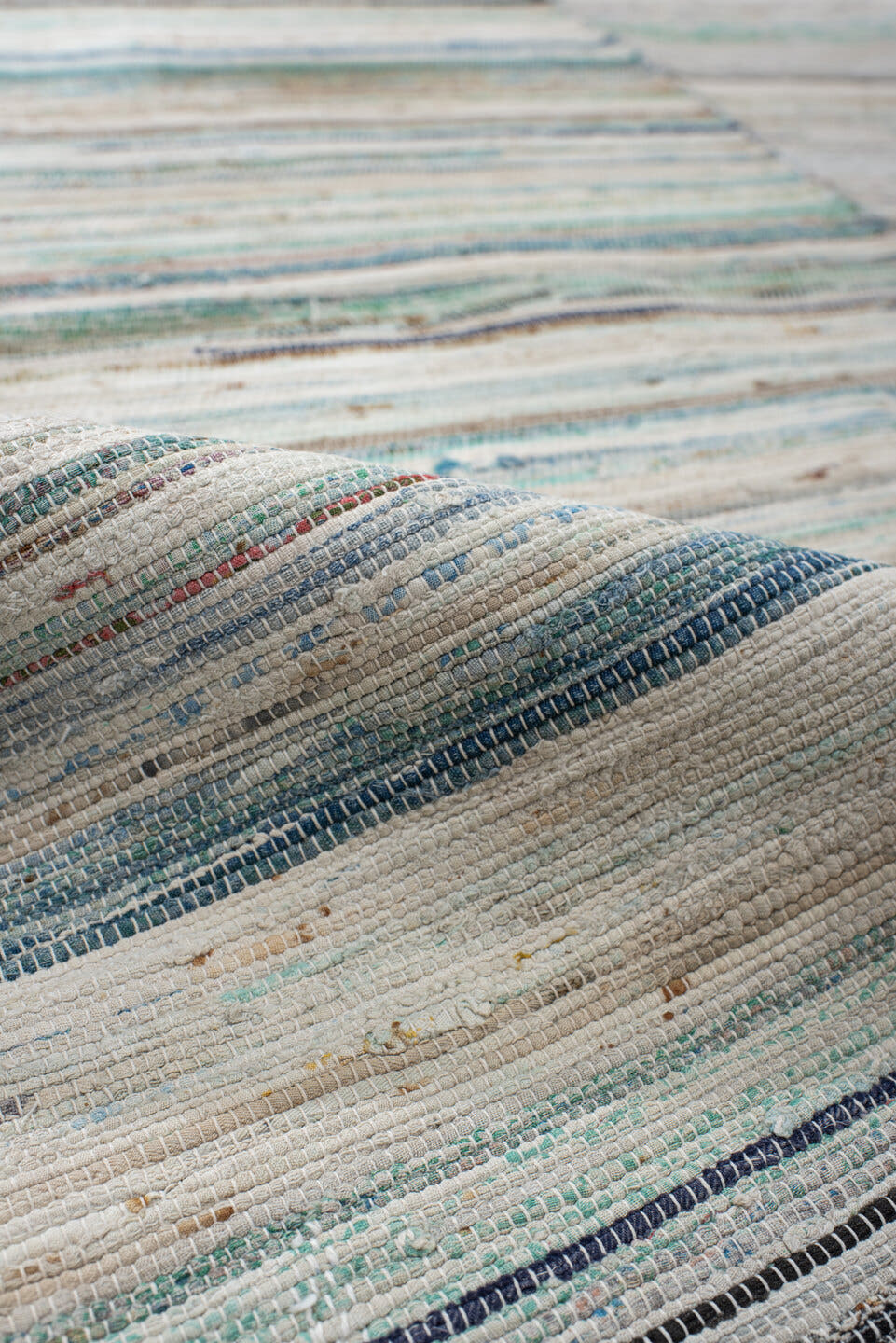 6' x 9' one-of-a-kind handmade antique Rag Rug medium size rug. Color palette: ivory, aqua, pale blue, charcoal, slate, rose