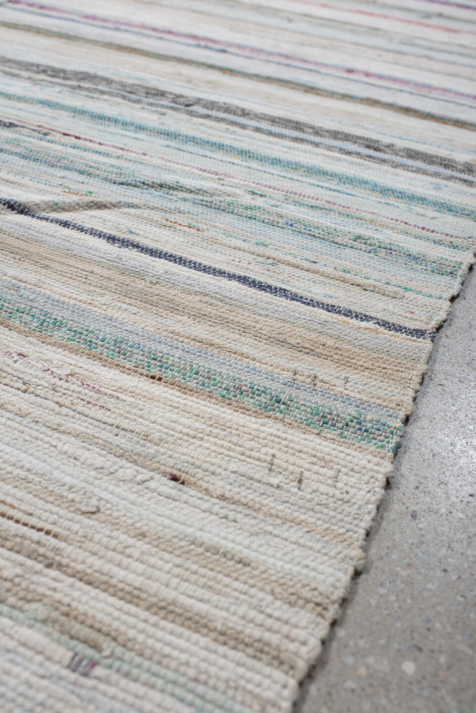 6' x 9' one-of-a-kind handmade antique Rag Rug medium size rug. Color palette: ivory, aqua, pale blue, charcoal, slate, rose