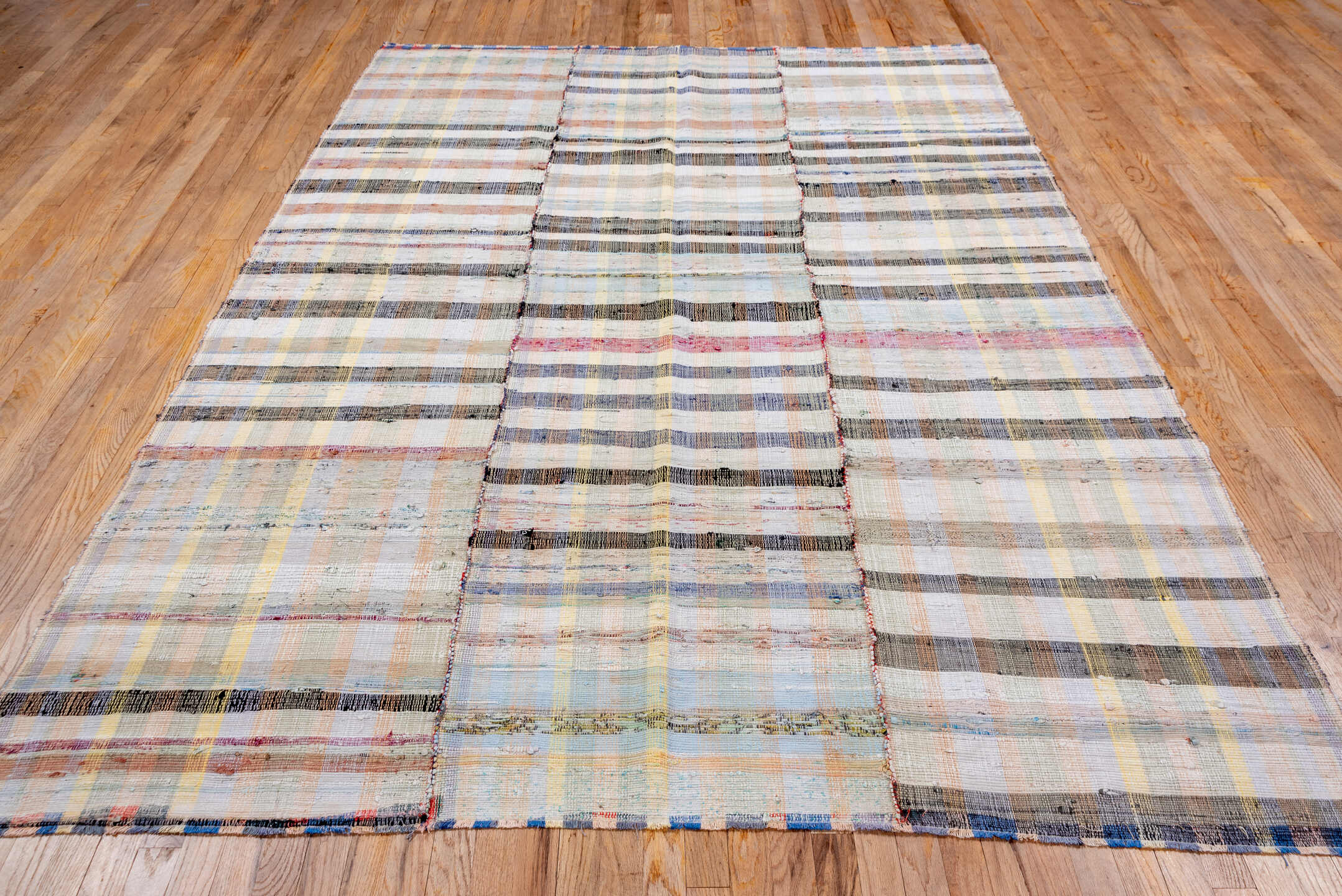 6' x 8' one-of-a-kind handmade antique Rag Rug rug. Color palette: ivory, taupe, charcoal, pale blue, butter yellow, blush