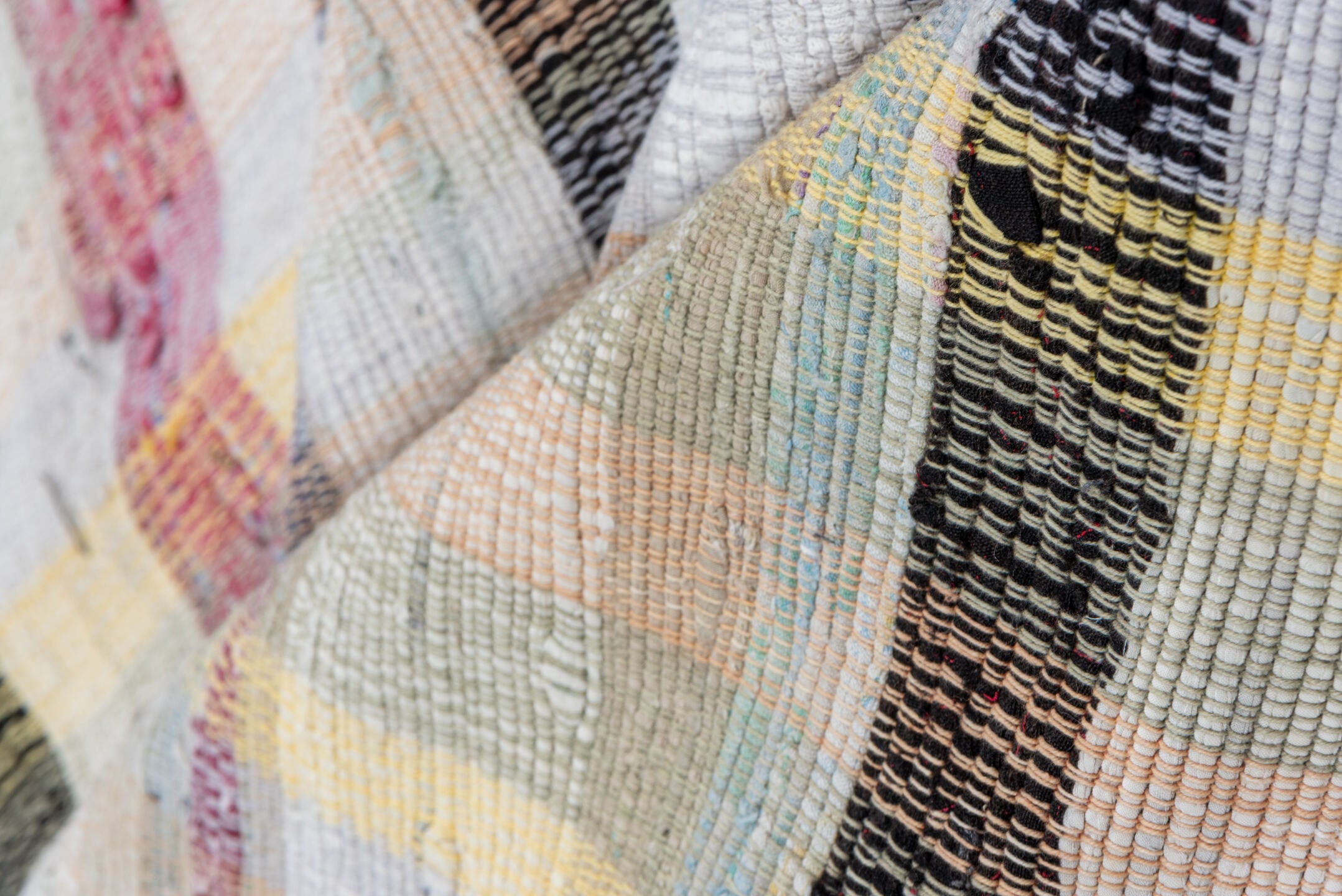 6' x 8' one-of-a-kind handmade antique Rag Rug rug. Color palette: ivory, taupe, charcoal, pale blue, butter yellow, blush