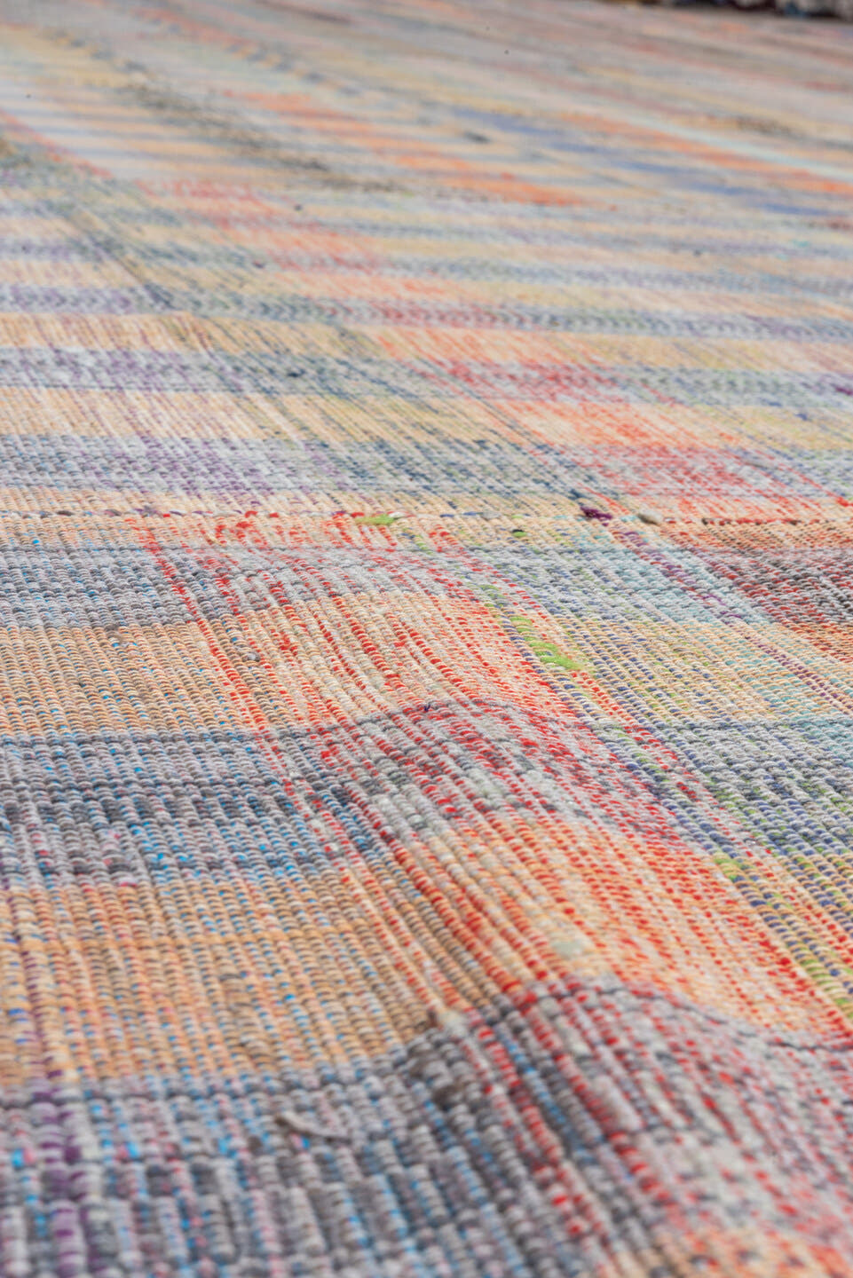 11' x 20' one-of-a-kind handmade vintage Rag Rug oversize rug. Color palette: taupe, blue, rose, peach, gray, ivory, rust