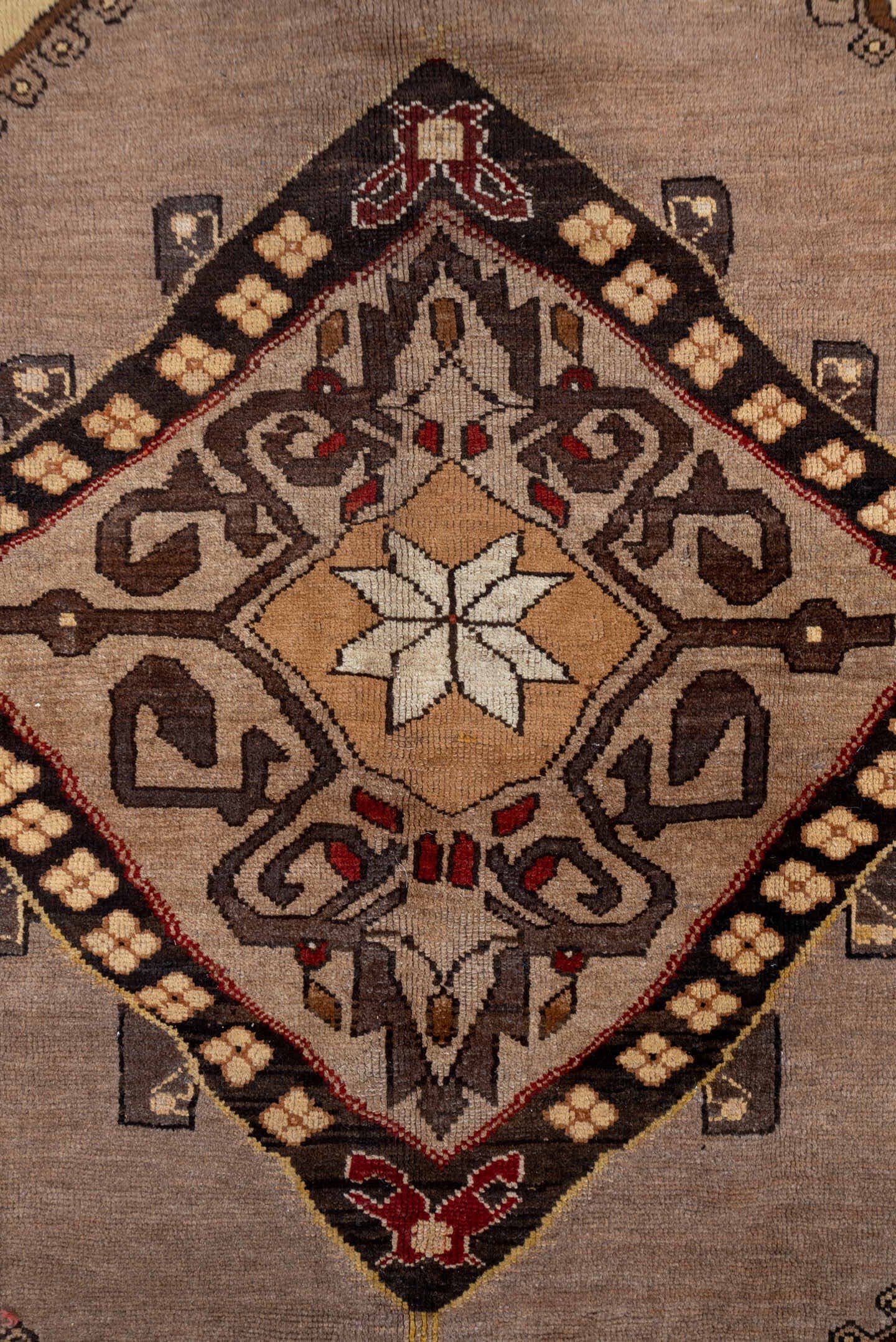7' x 9' one-of-a-kind handmade vintage Kars rug. Color palette: taupe, brown, ivory, walnut, rust, charcoal, camel, burgundy