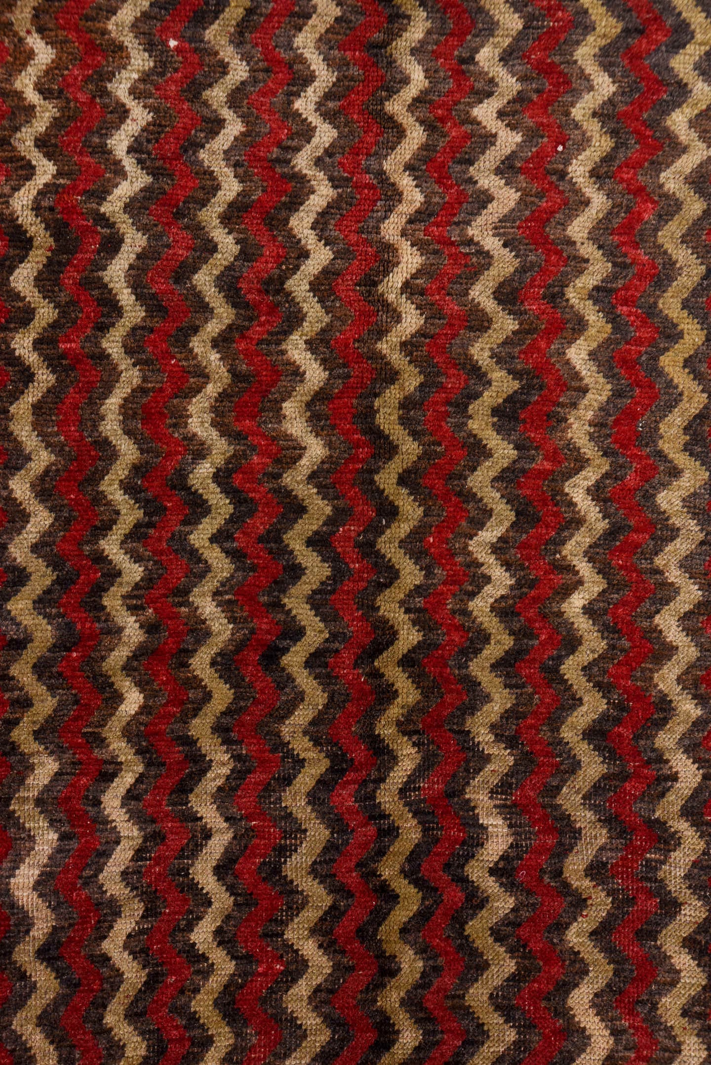4' x 12' one-of-a-kind handmade vintage Tulu runner rug. Color palette: brown, red, taupe, charcoal, beige, gray, black
