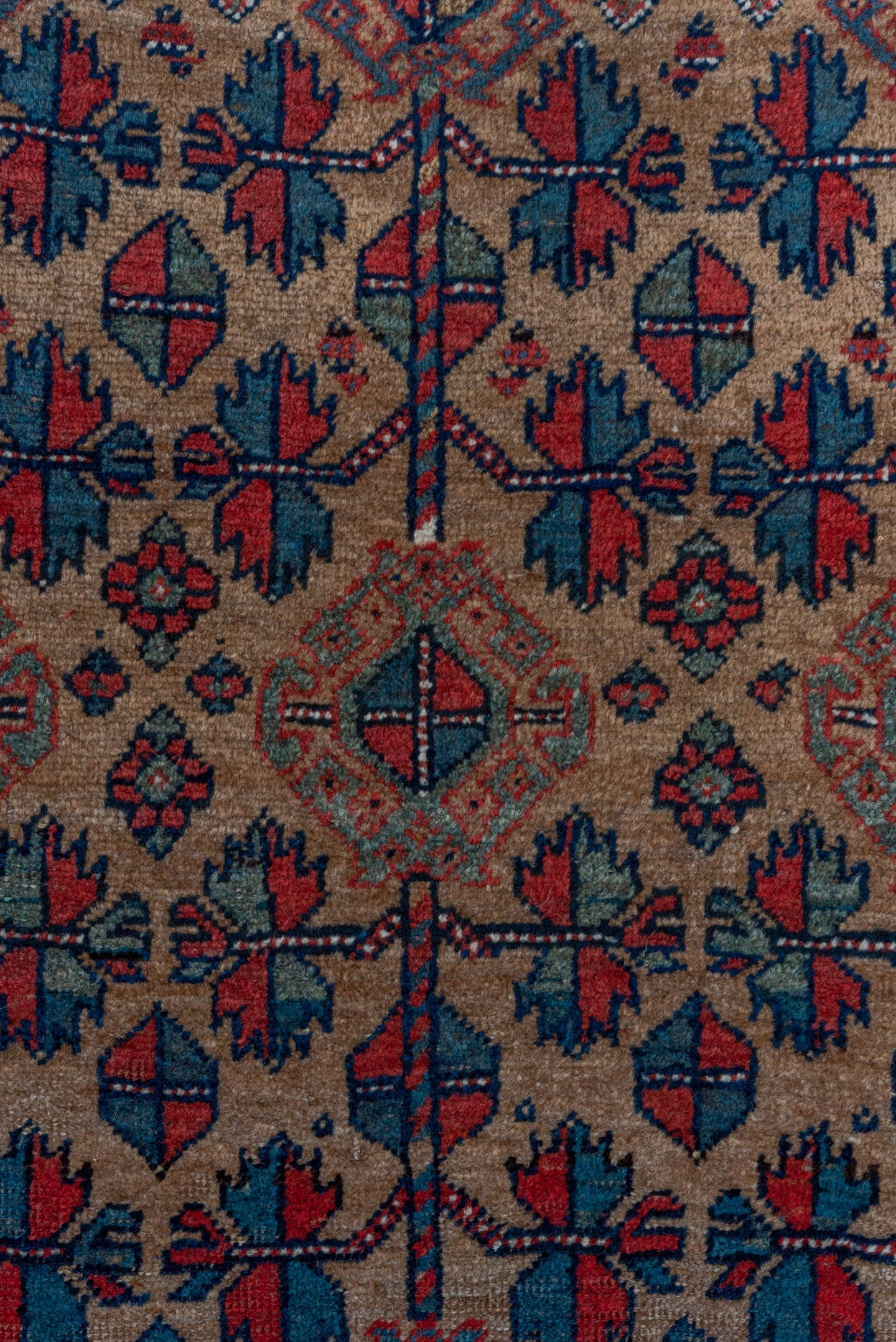 3' x 5' one-of-a-kind handmade vintage Kurd small size rug. Color palette: rust, camel, indigo, ivory, crimson, charcoal