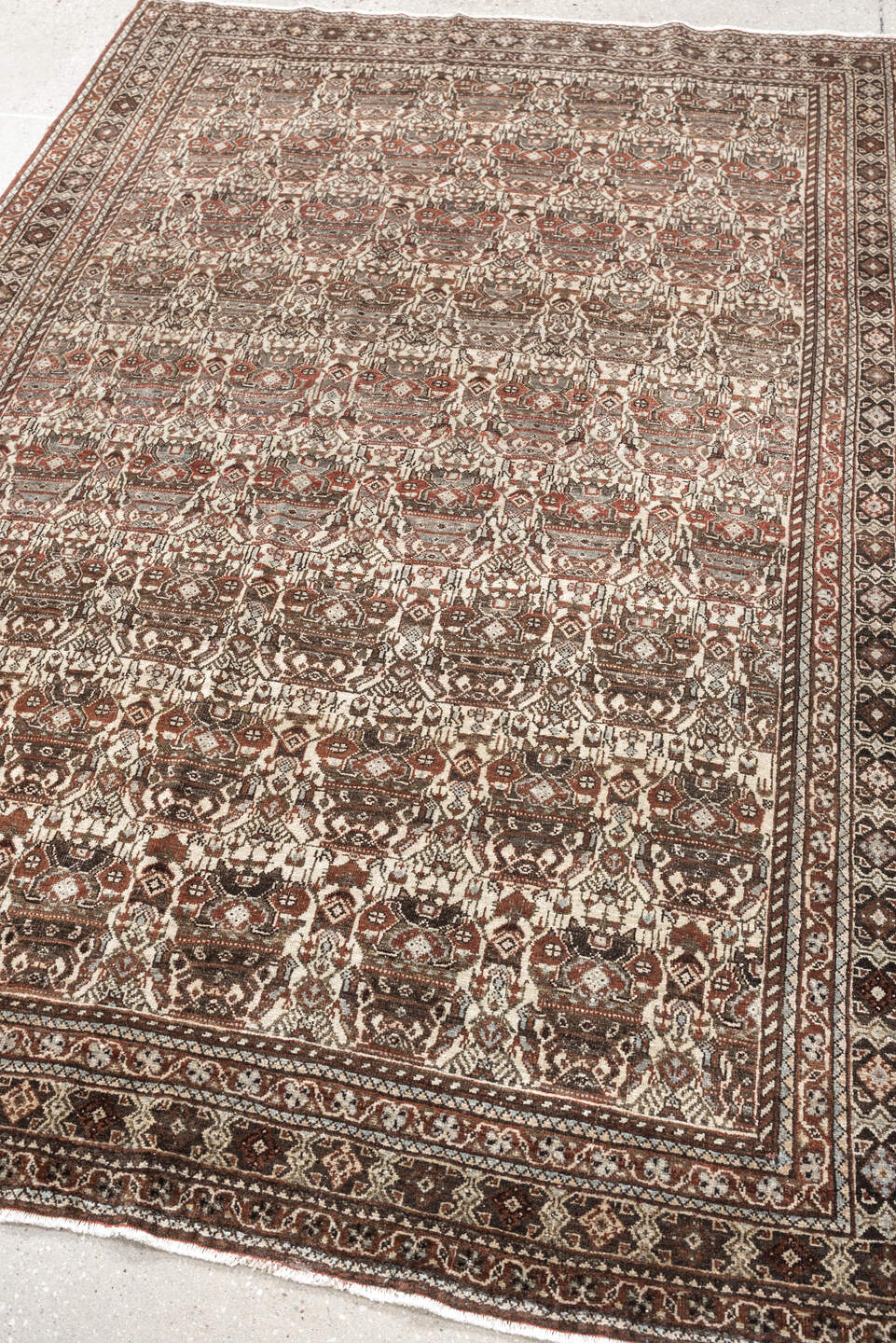 4' x 6' one-of-a-kind handmade antique Abadeh rug. Color palette: ivory, rust, brown, slate, charcoal, taupe, terracotta