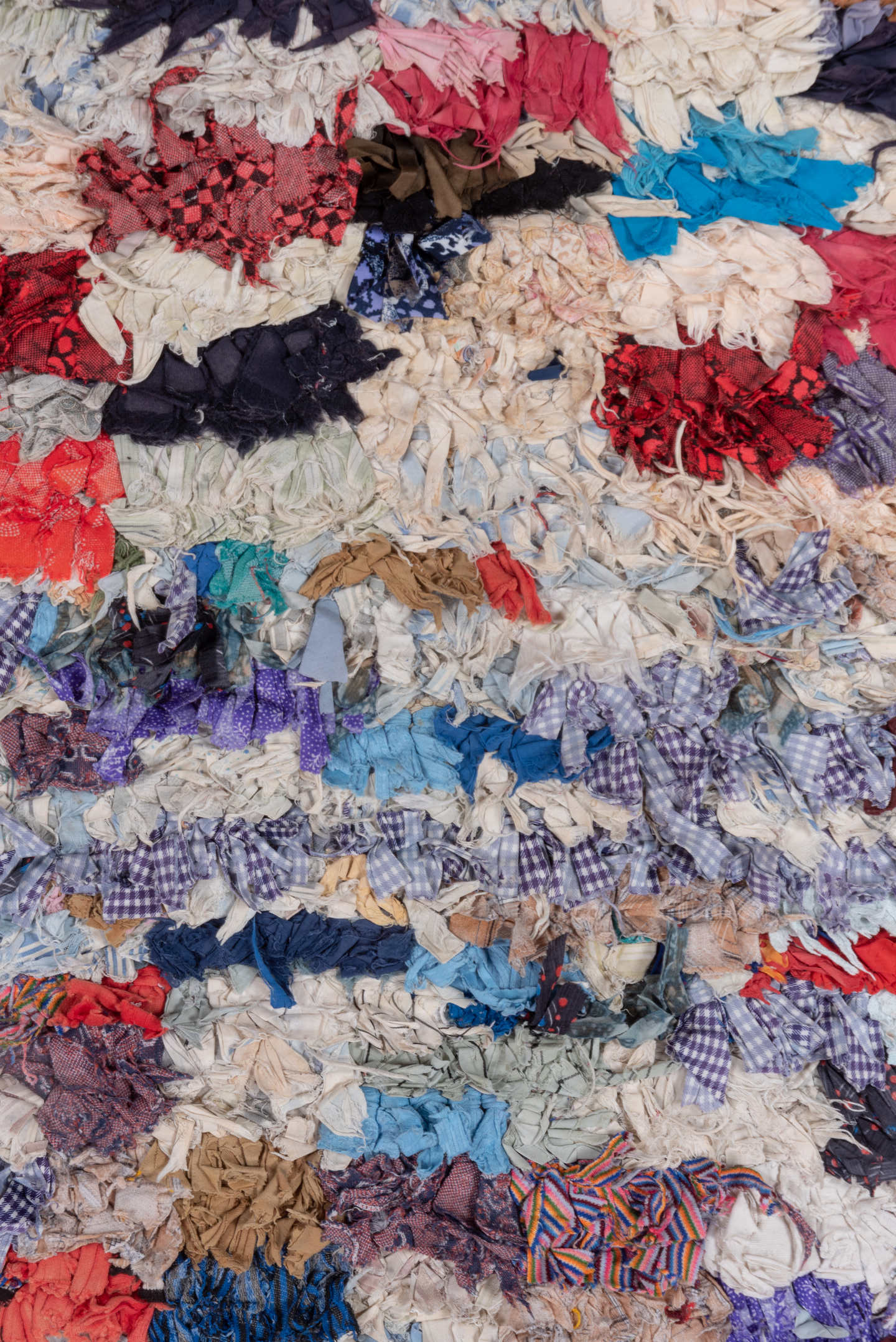 2' x 5' one-of-a-kind handmade vintage Rag Rug small size rug. Color palette: ivory, pale blue, navy, crimson, brown, violet