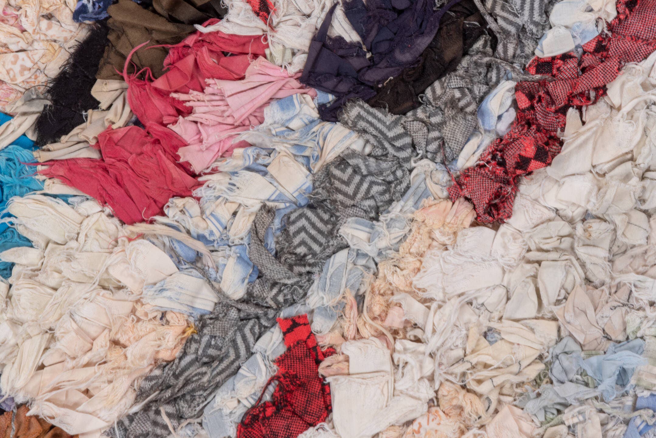 2' x 5' one-of-a-kind handmade vintage Rag Rug small size rug. Color palette: ivory, pale blue, navy, crimson, brown, violet