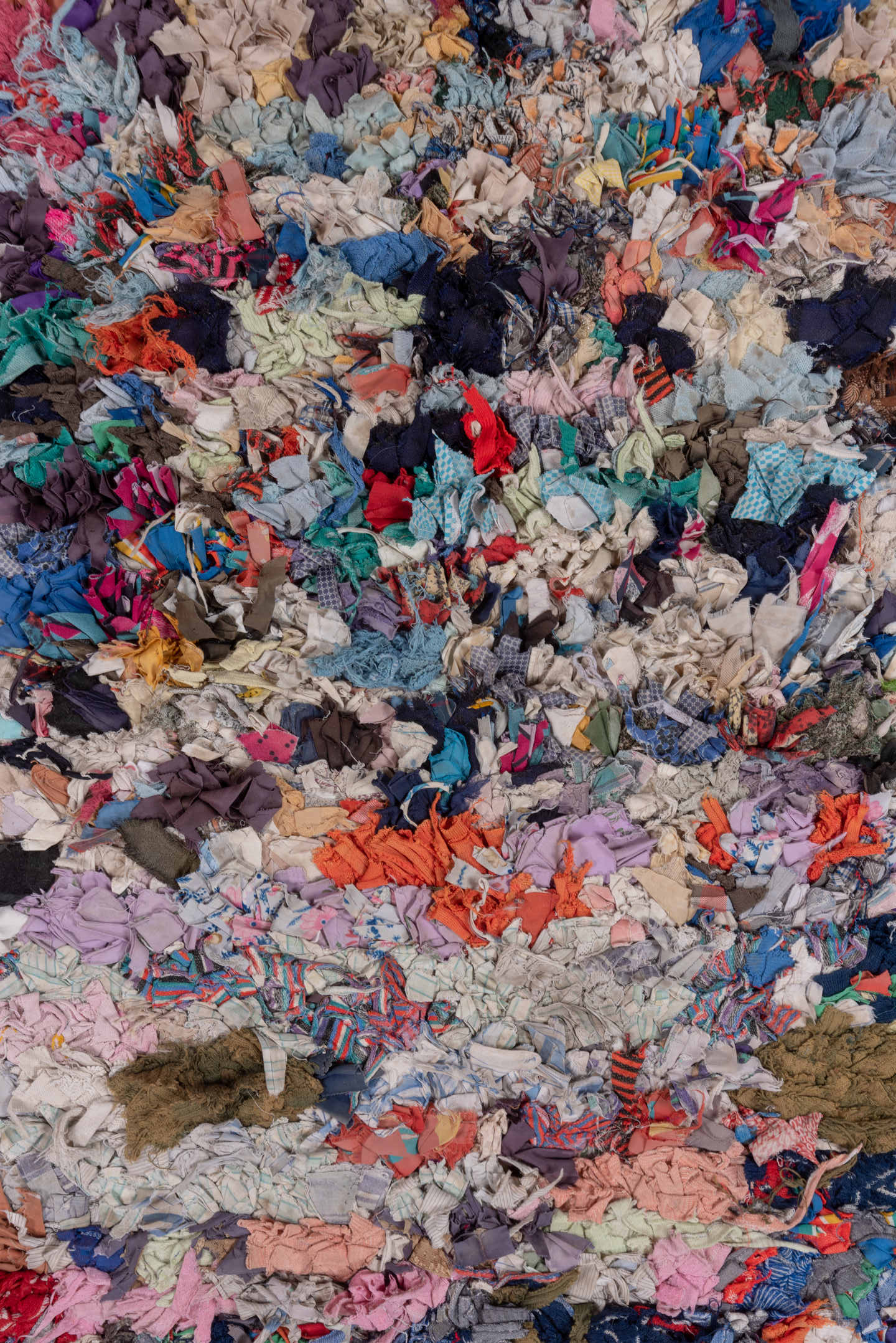 4' x 7' one-of-a-kind handmade vintage Rag Rug rug. Color palette: ivory, gray, blue, pink, purple, red, yellow, charcoal