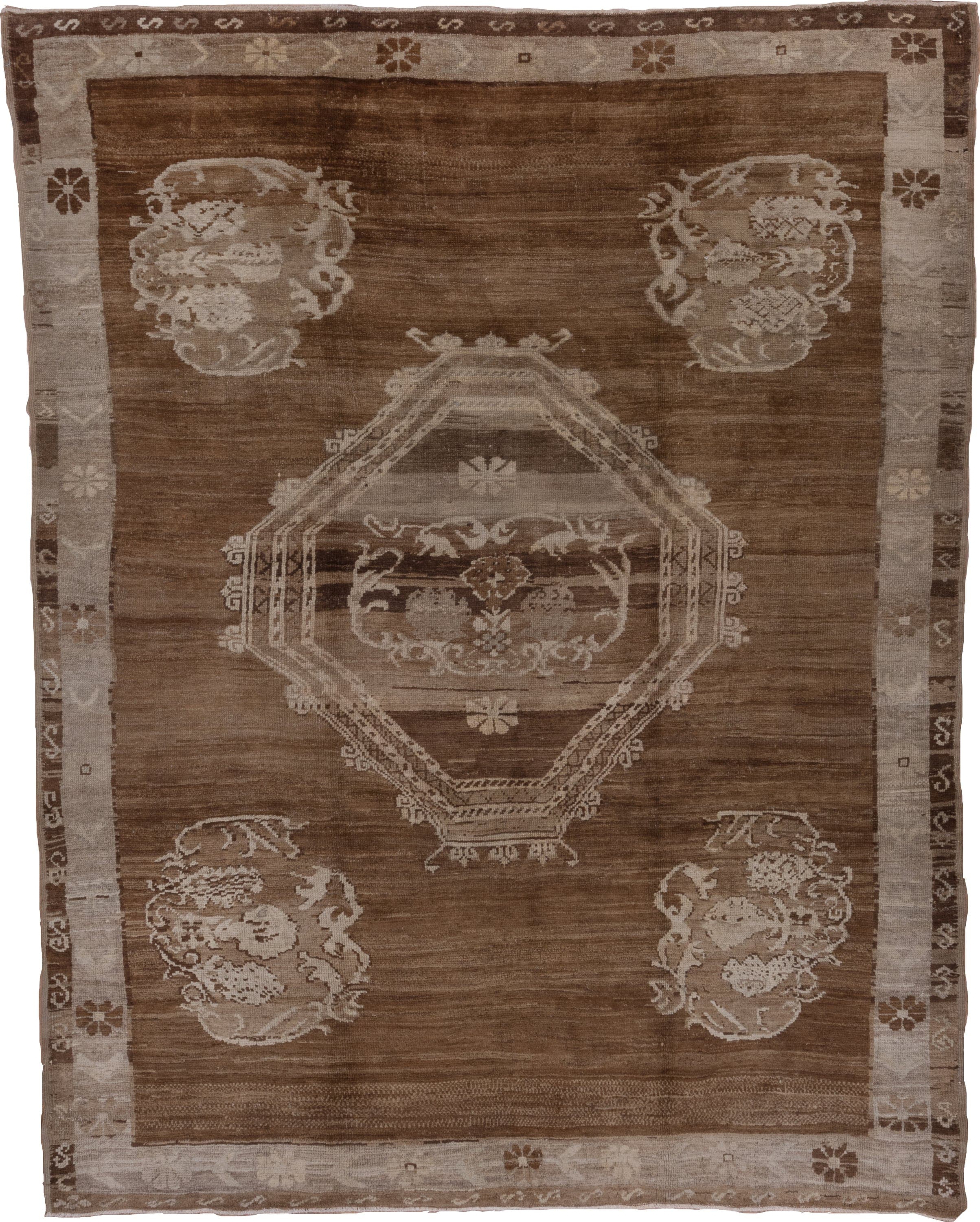 7' x 9' one-of-a-kind handmade vintage Oushak rug. Color palette: brown, taupe, ivory, beige, camel, gray