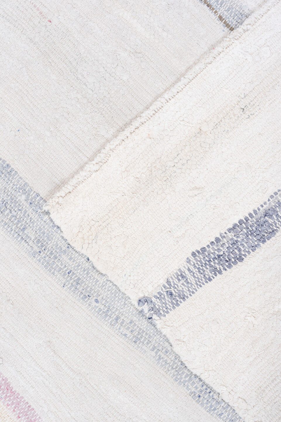 5' x 10' one-of-a-kind handmade vintage Rag Rug medium size rug. Color palette: ivory, pale blue, sky blue, charcoal, blush