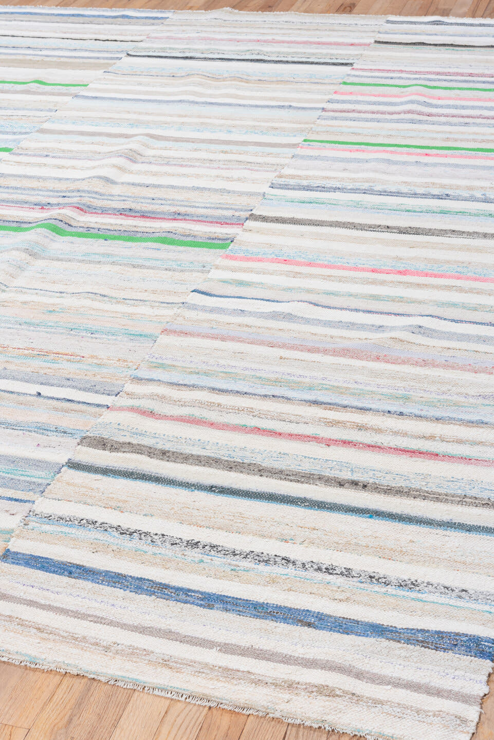 7' x 10' one-of-a-kind handmade vintage Rag Rug large size rug. Color palette: ivory, pale blue, beige, charcoal, pink