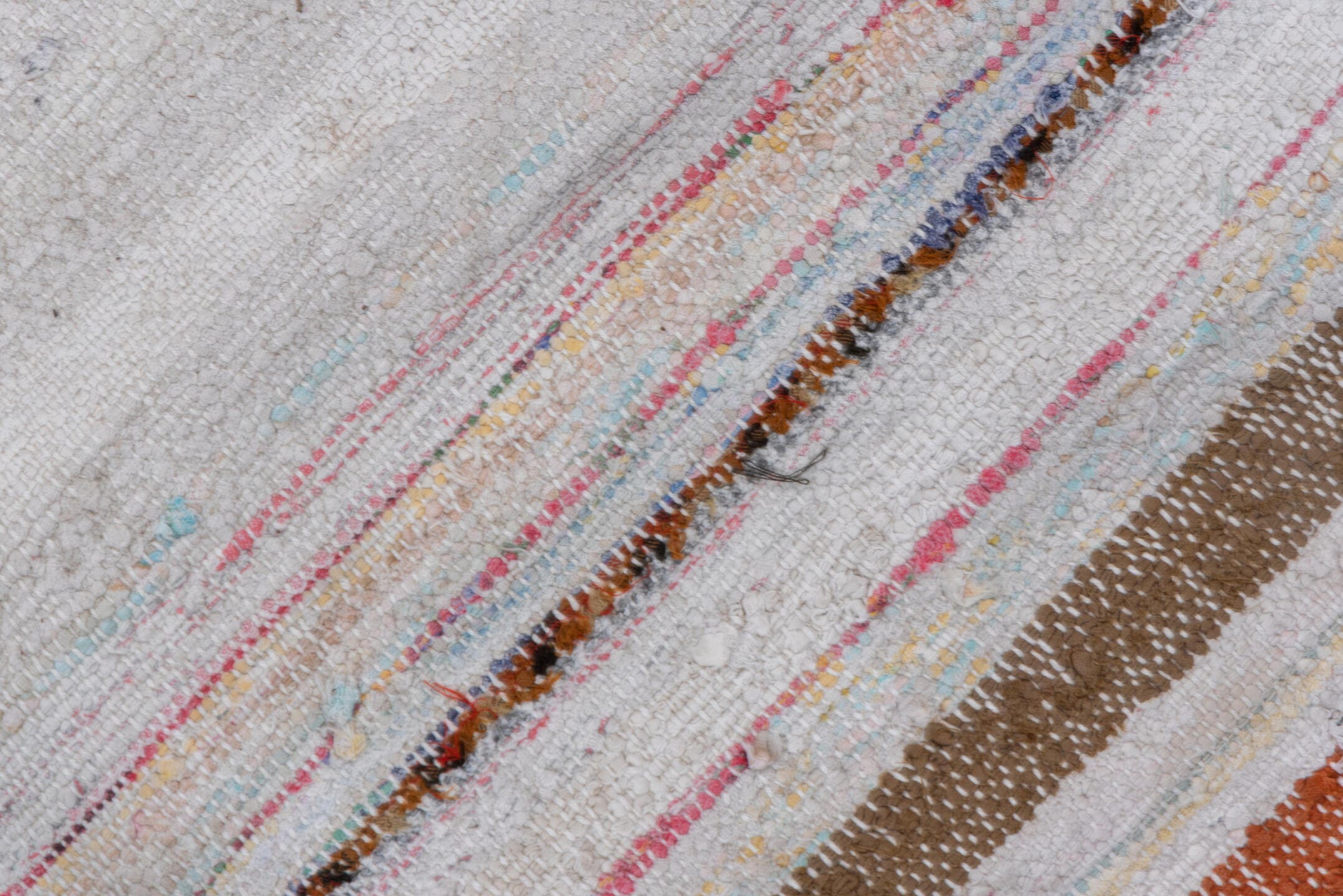 7' x 8' one-of-a-kind handmade antique Rag Rug rug. Color palette: ivory, rose, pale blue, peach, gray, tan, pink, red