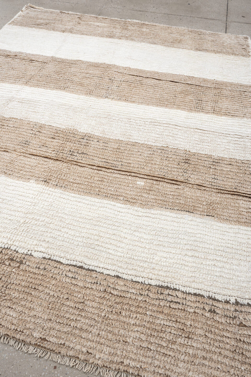 5' x 7' one-of-a-kind handmade antique Moroccan rug. Color palette: taupe, ivory, cream, greige, stone, beige, gray