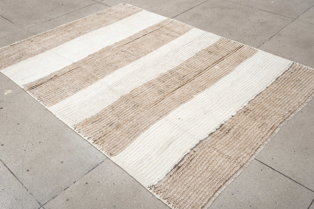 5' x 7' one-of-a-kind handmade antique Moroccan rug. Color palette: taupe, ivory, cream, greige, stone, beige, gray