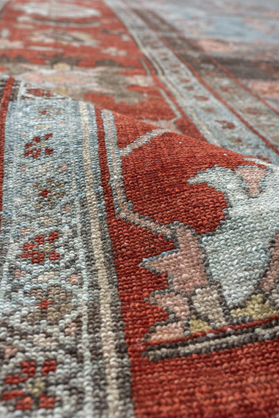 7' x 16' one-of-a-kind handmade antique Lilian rug. Color palette: blue, terracotta, ivory, slate, rose, taupe, charcoal