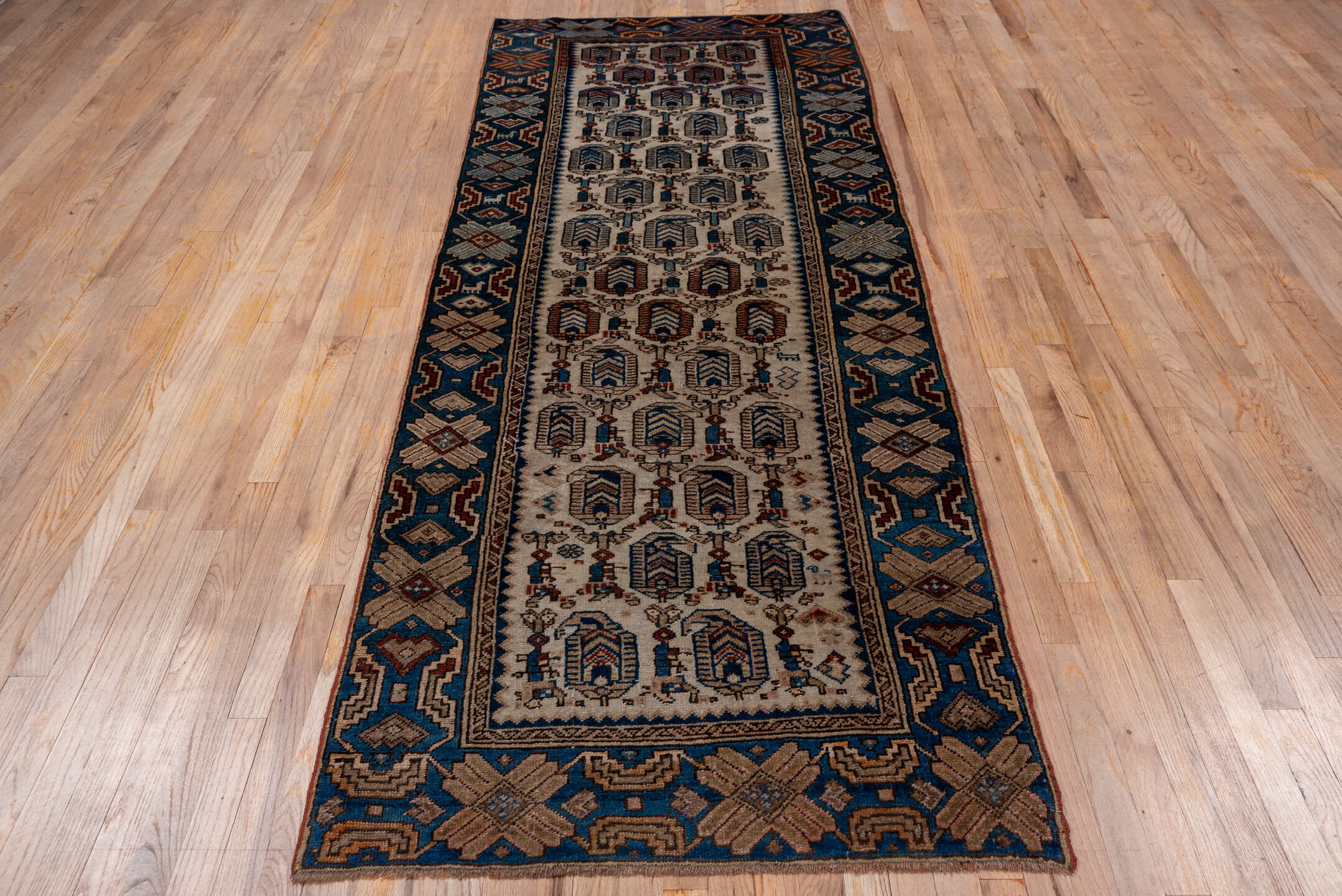 3' x 9' one-of-a-kind handmade antique NW Persian runner rug. Color palette: ivory, indigo, camel, rust, slate, brown