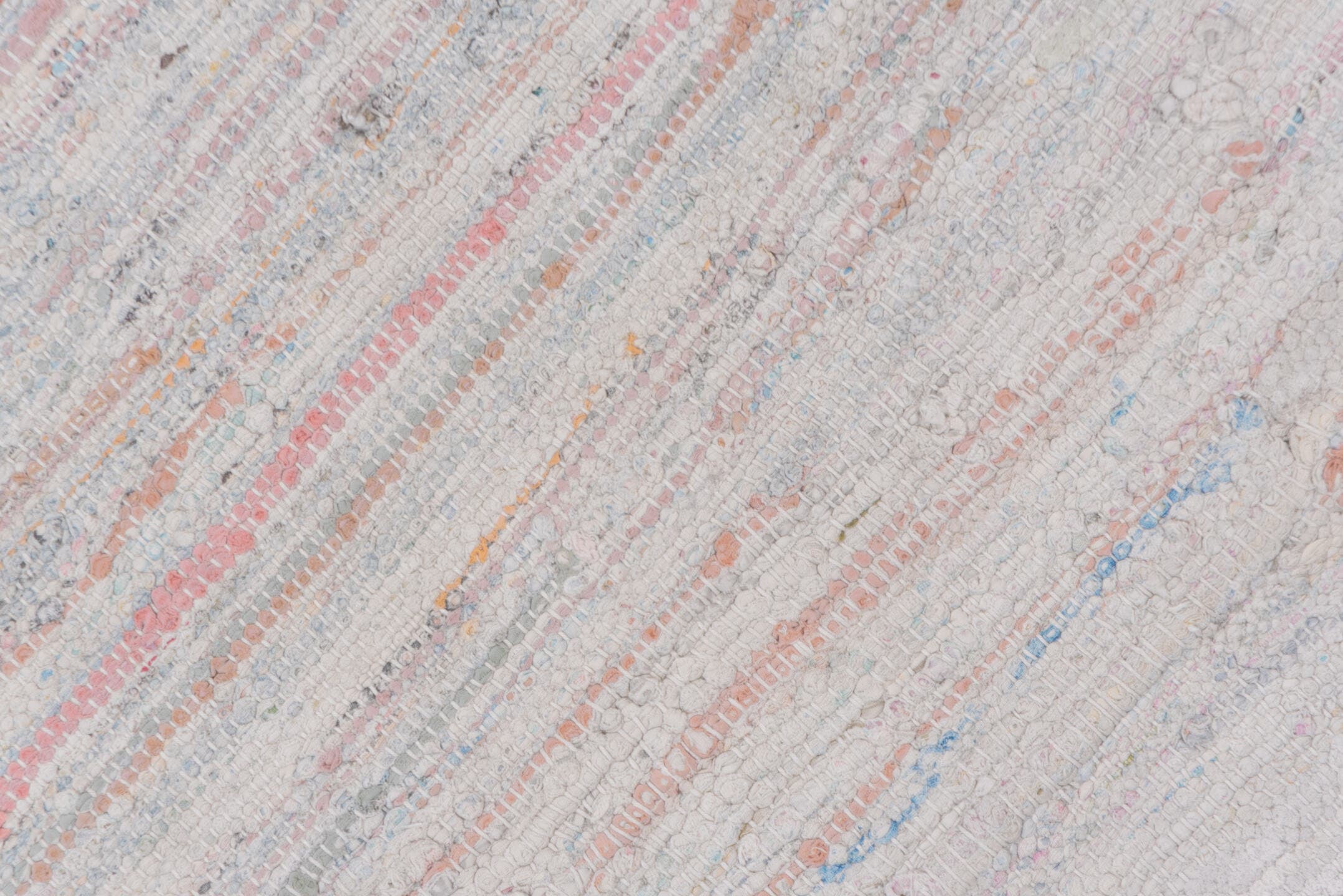 5' x 7' one-of-a-kind handmade antique Rag Rug rug. Color palette: ivory, blush, pale blue, peach, taupe, pink, light blue