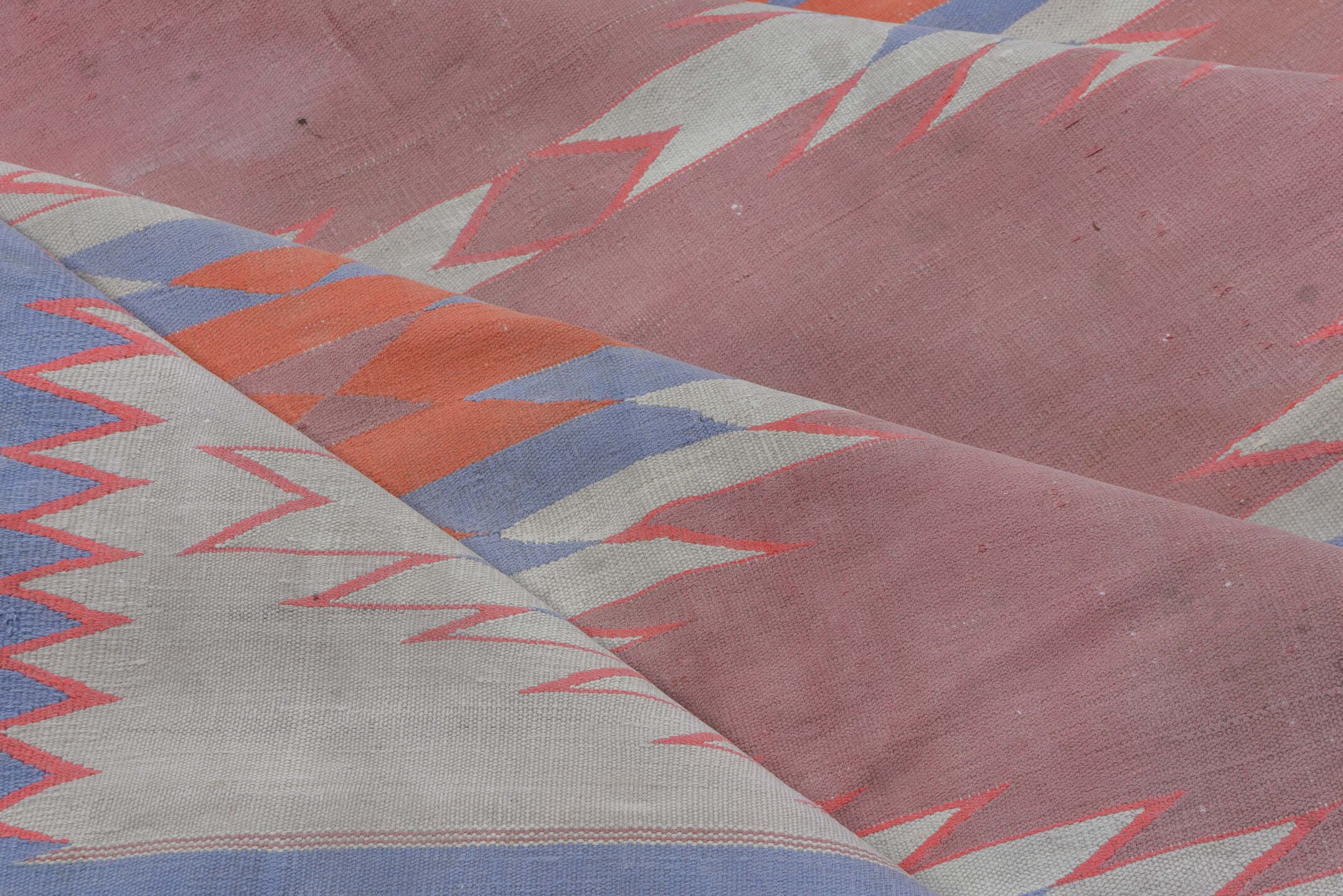 9' x 16' one-of-a-kind handmade antique Dhurrie rug. Color palette: dusty rose, ivory, sky blue, coral, slate blue, pink