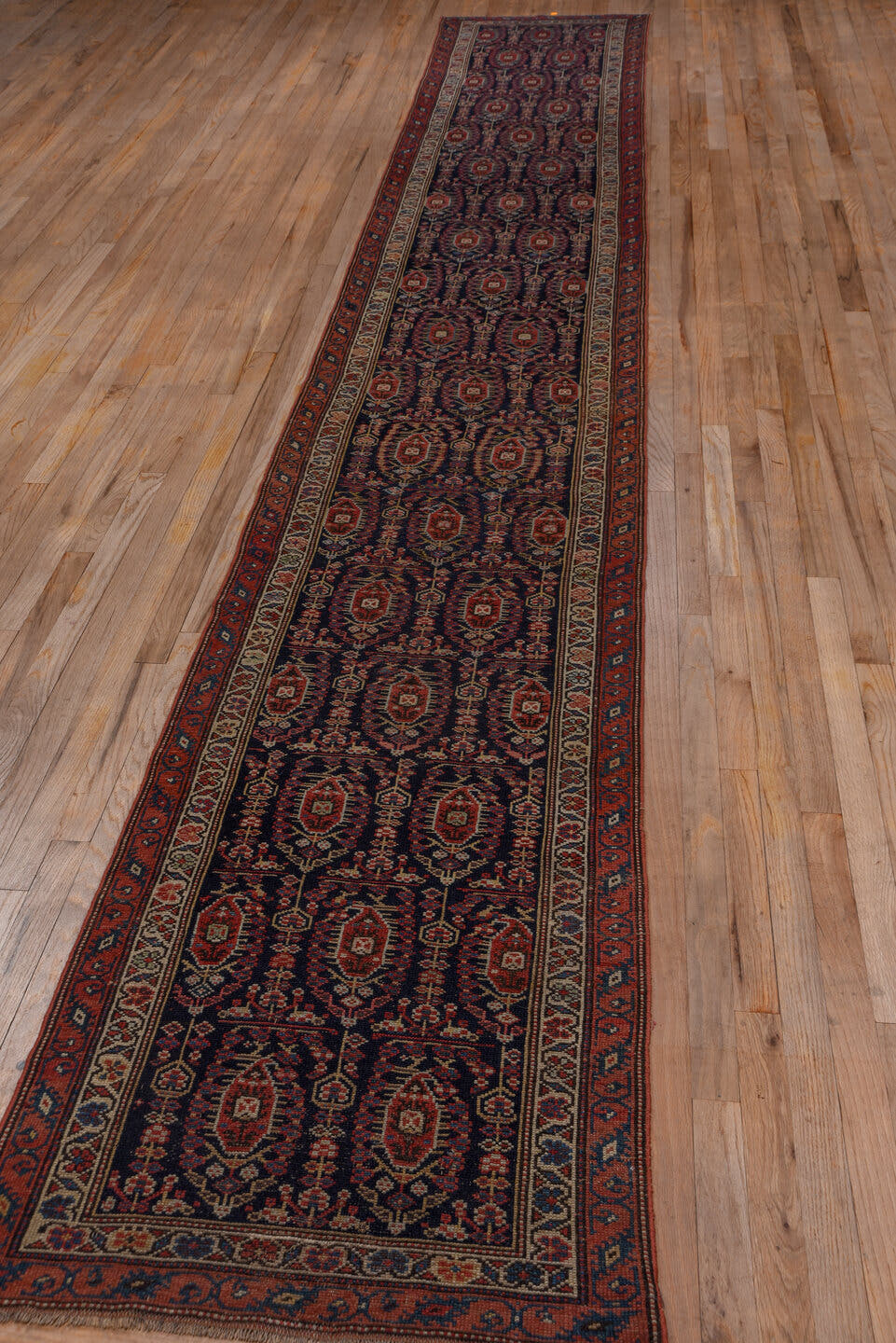 2' x 17' one-of-a-kind handmade antique NW Persian runner rug. Color palette: navy, rust, ivory, crimson, slate, camel, blue