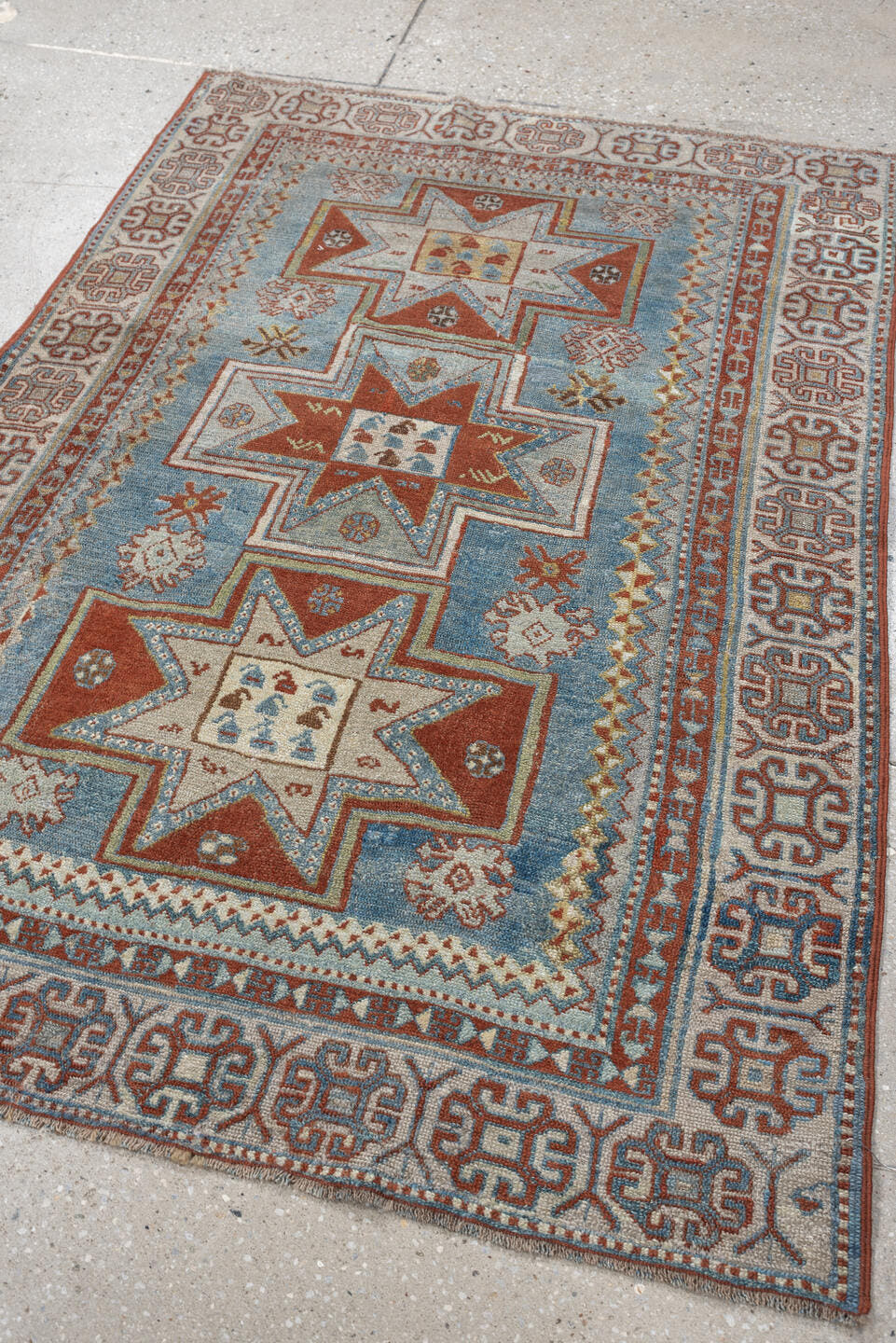 3' x 4' one-of-a-kind handmade antique Caucasian small size rug. Color palette: ivory, sky blue, rust, terra cotta, camel