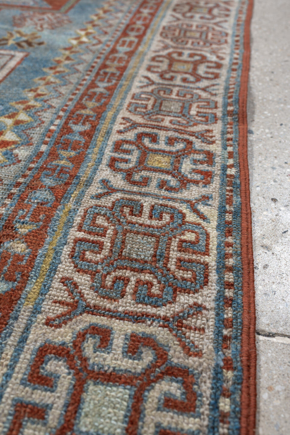 3' x 4' one-of-a-kind handmade antique Caucasian small size rug. Color palette: ivory, sky blue, rust, terra cotta, camel