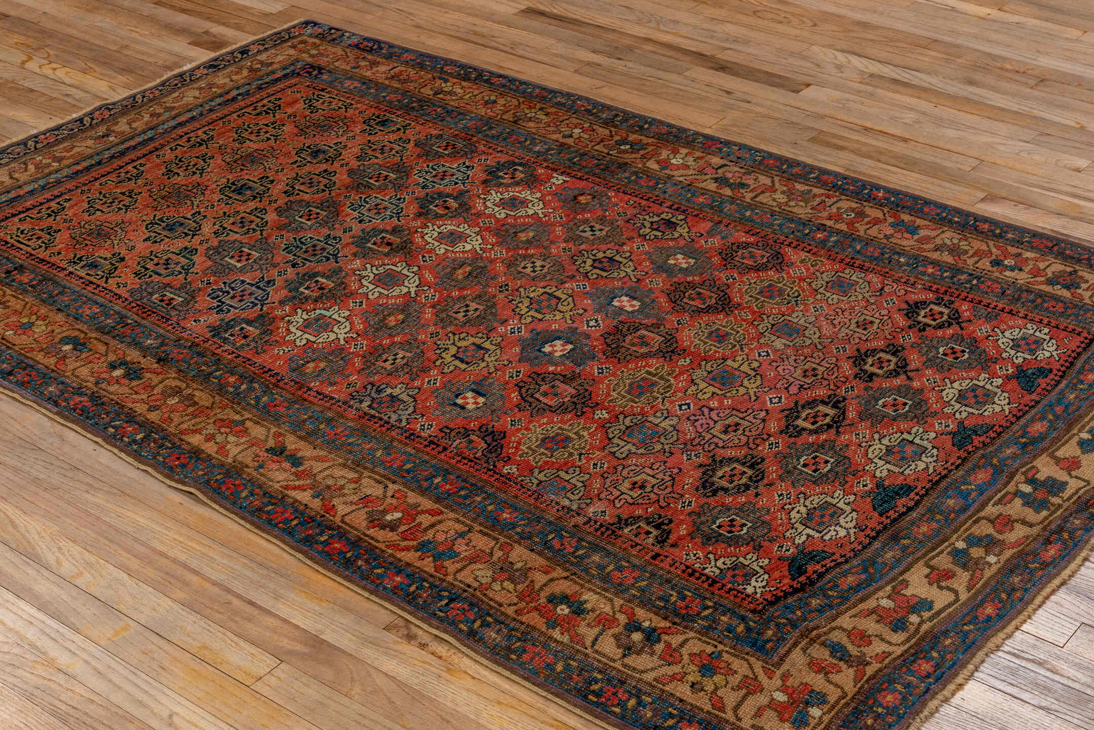 4' x 7' one-of-a-kind handmade vintage Bidjar rug. Color palette: rust, navy, ivory, blue, camel, crimson, charcoal, gold