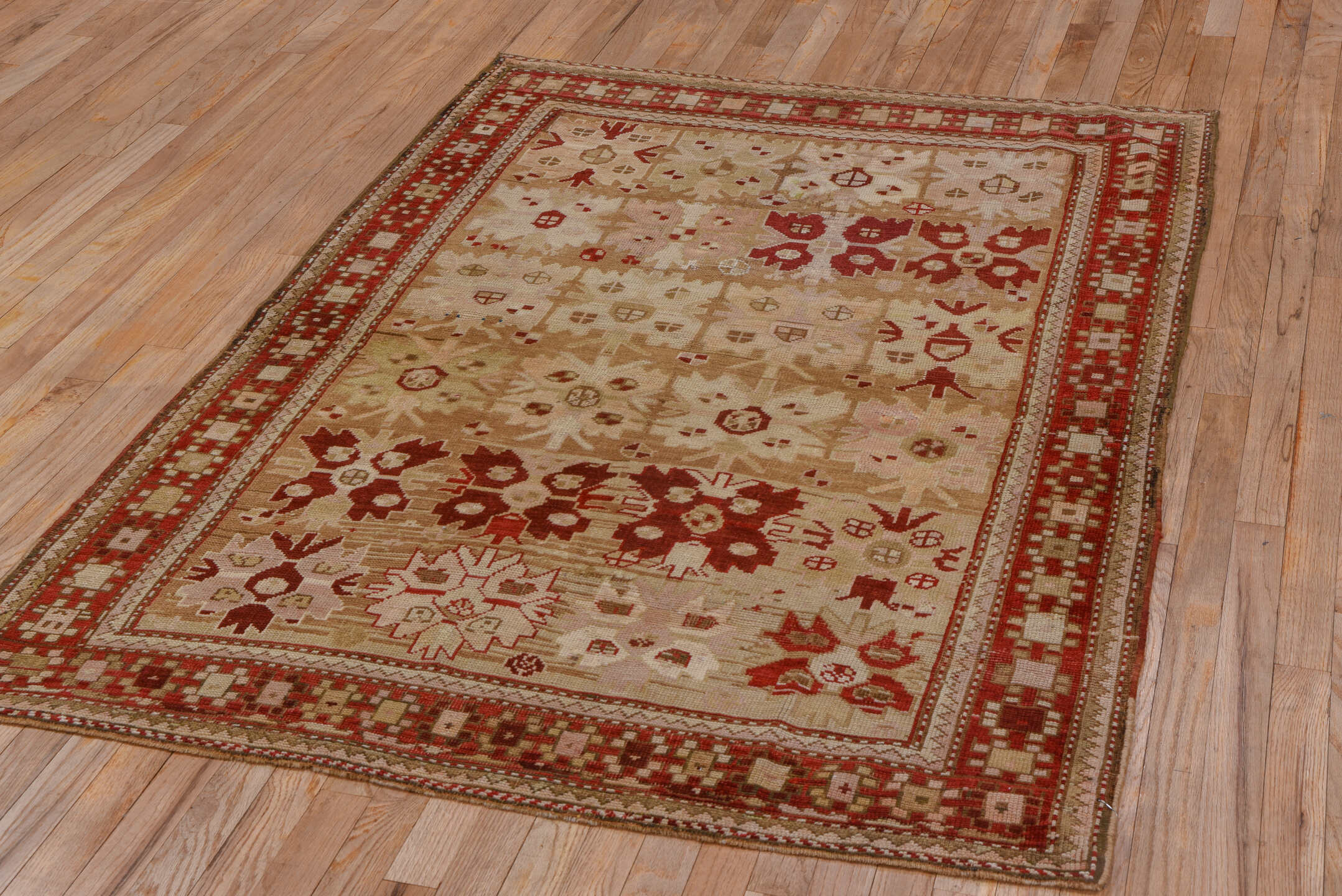 4' x 6' one-of-a-kind handmade antique Caucasian small size rug. Color palette: ivory, rust, beige, camel, taupe, sienna