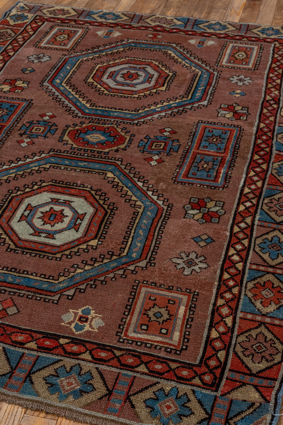 3' x 5' one-of-a-kind handmade antique Caucasian small size rug. Color palette: rose, ivory, sky_blue, rust, slate_blue
