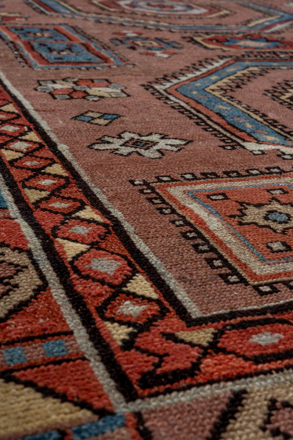 3' x 5' one-of-a-kind handmade antique Caucasian small size rug. Color palette: rose, ivory, sky_blue, rust, slate_blue