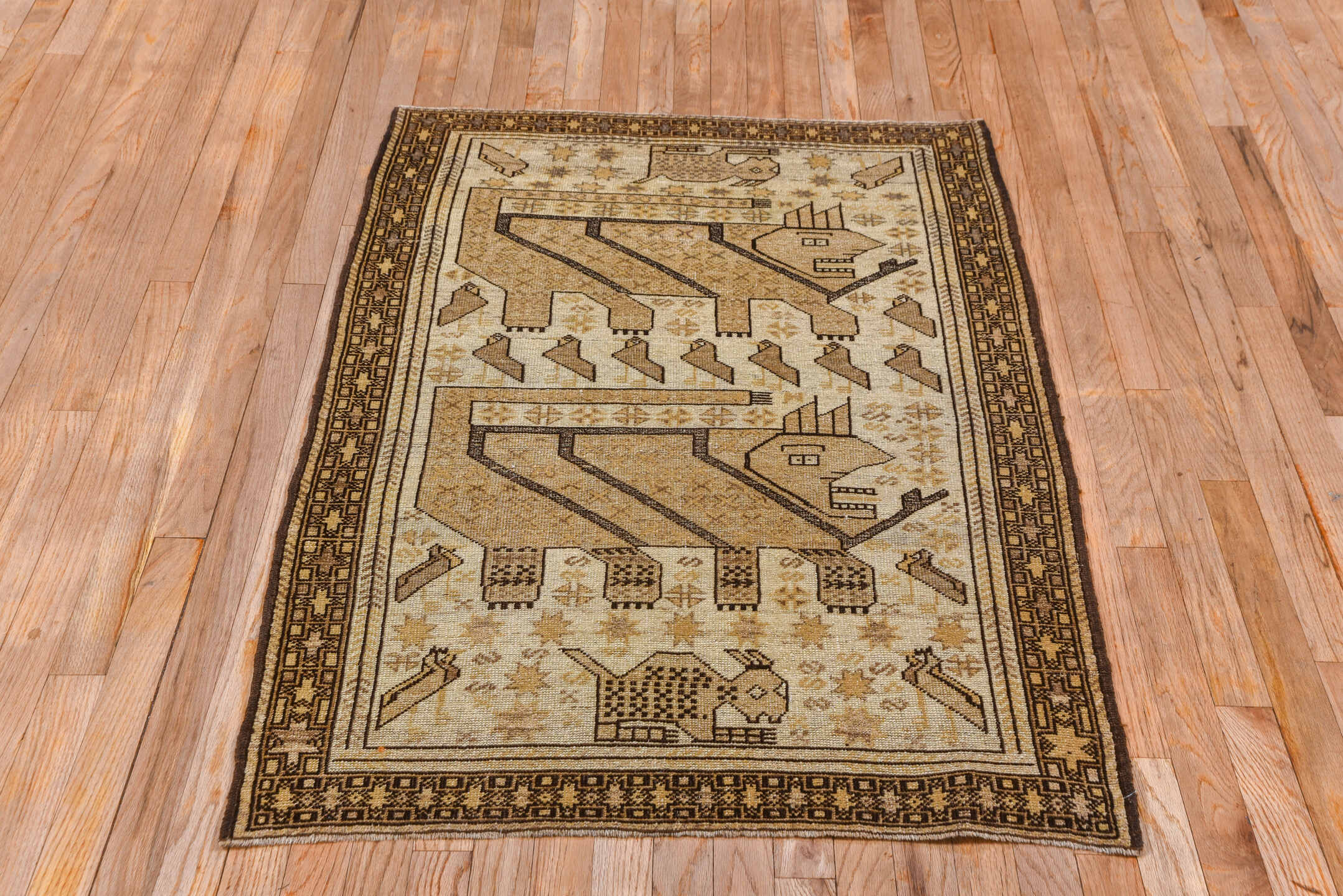 3' x 4' one-of-a-kind handmade antique Belouch small size rug. Color palette: camel, brown, ivory, taupe, charcoal, beige