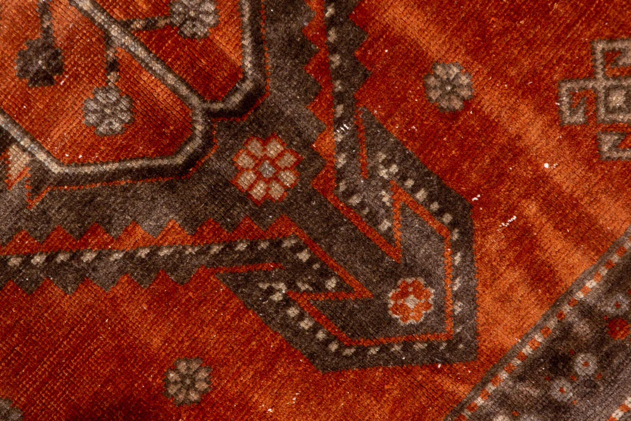 4' x 7' one-of-a-kind handmade vintage Caucasian rug. Color palette: terra cotta, ivory, brown, rust, taupe, charcoal, camel