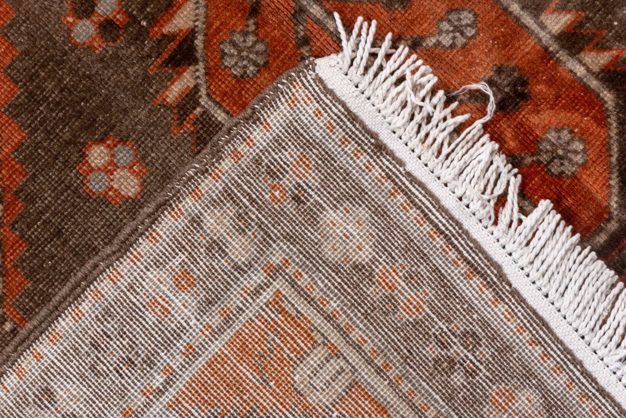 4' x 7' one-of-a-kind handmade vintage Caucasian rug. Color palette: terra cotta, ivory, brown, rust, taupe, charcoal, camel
